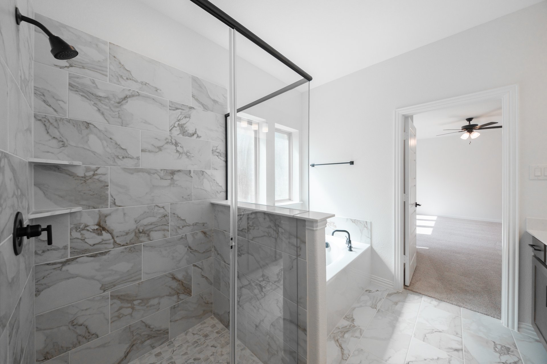 primary bathroom with soaking tub and walk-in shower