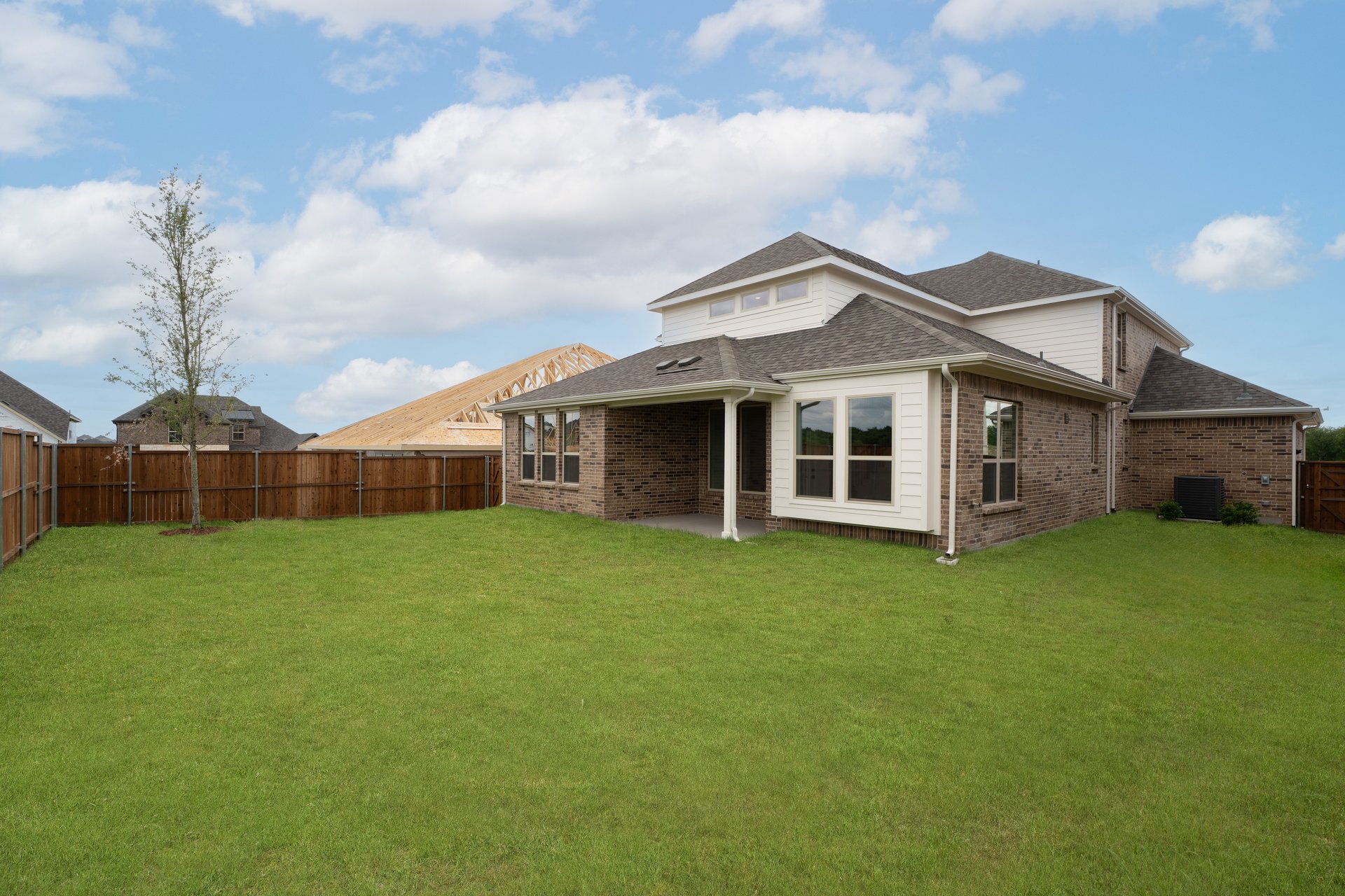 backyard with grass and covered patio