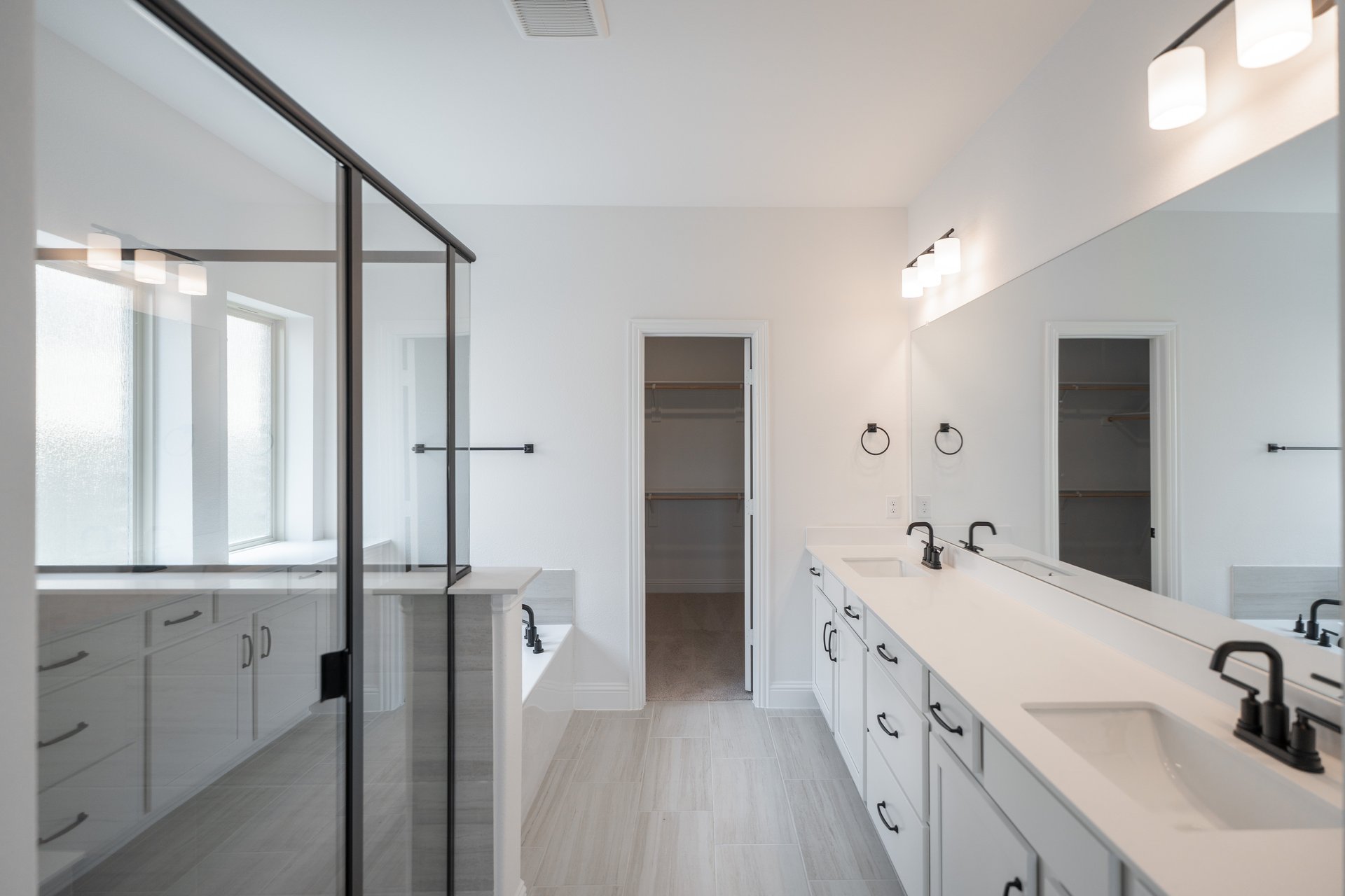 primary bathroom with soaking tub and walk-in shower