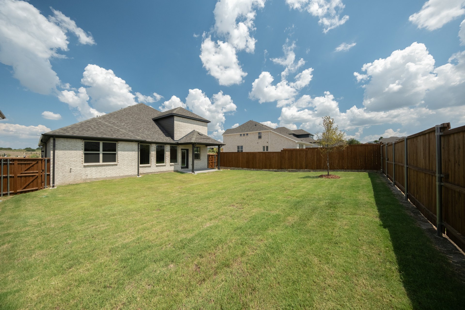 backyard of home with covered patio