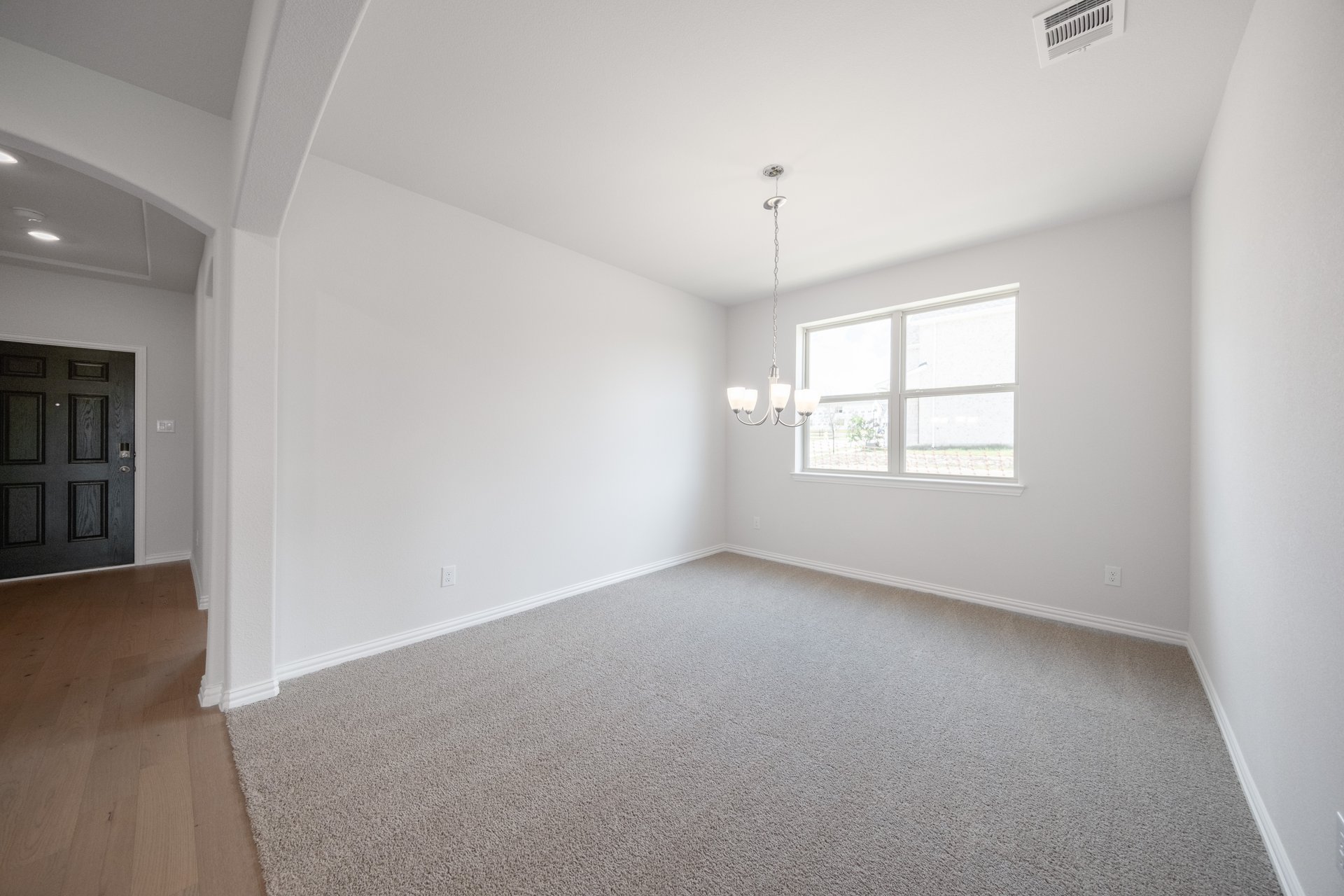 open dining room with carpet and window