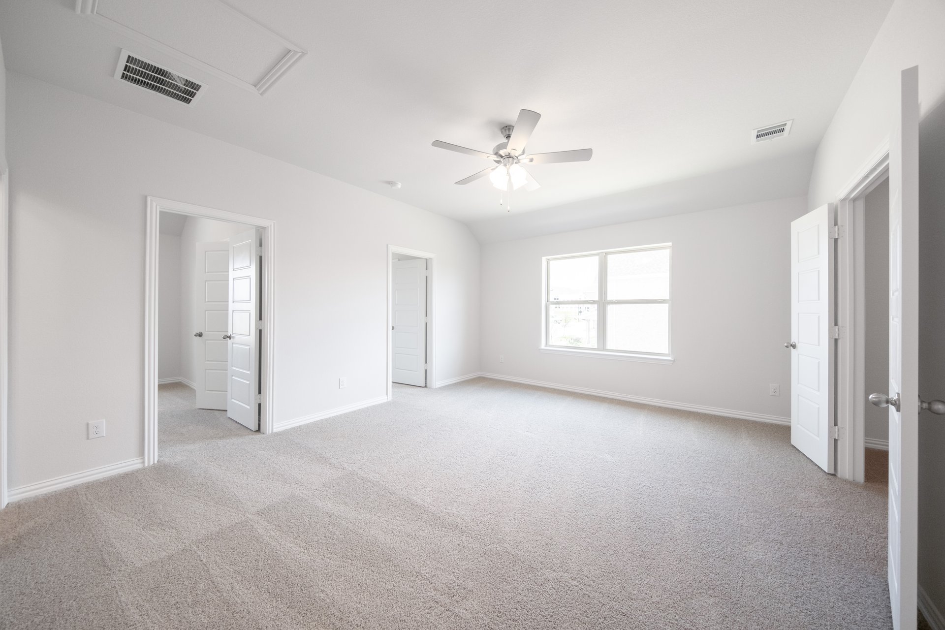 spacious loft with carpet and window