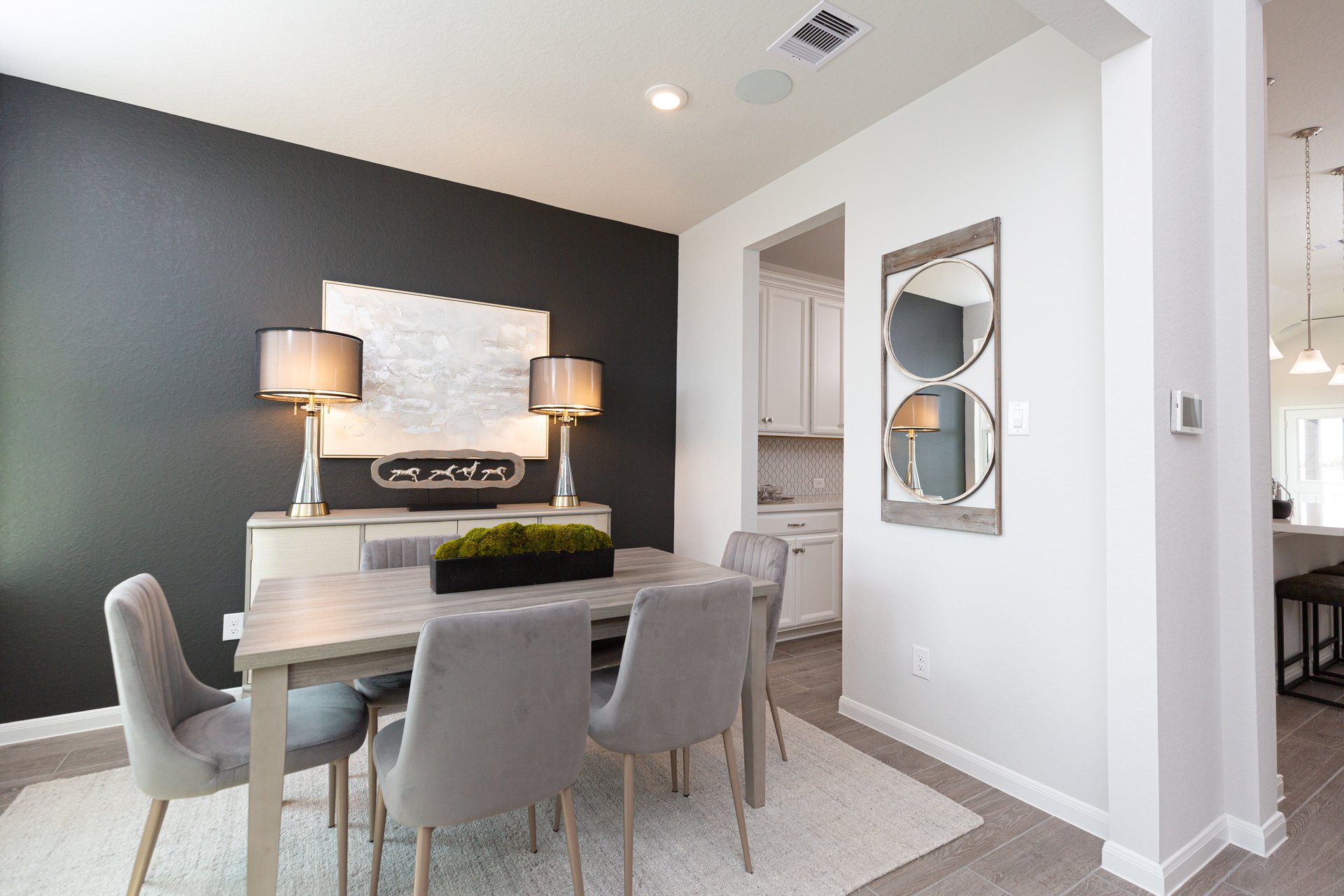 dining area with two lamps