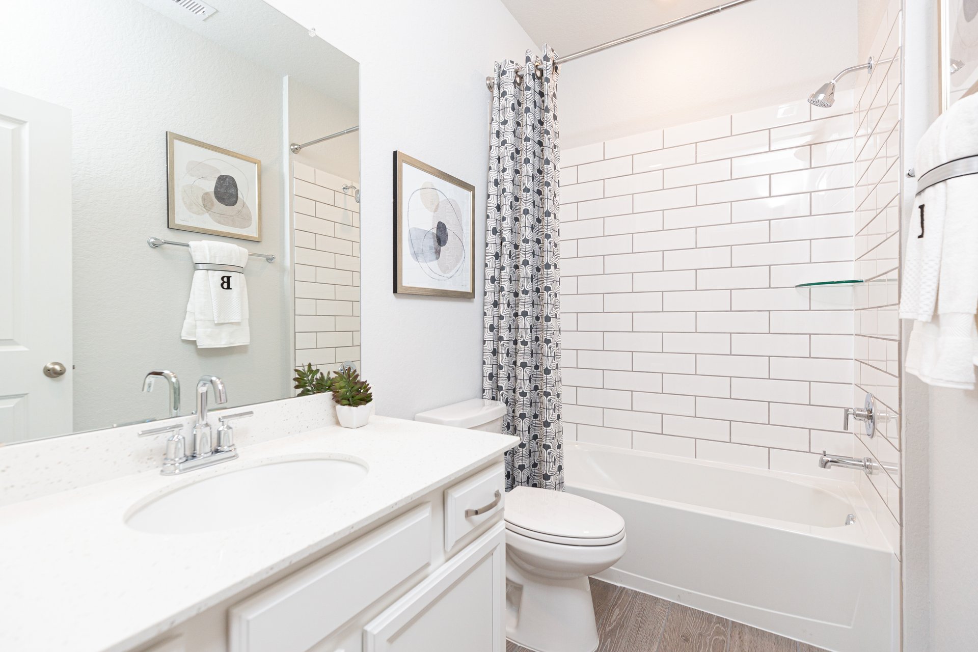 bathroom with white subway tile on shower wall