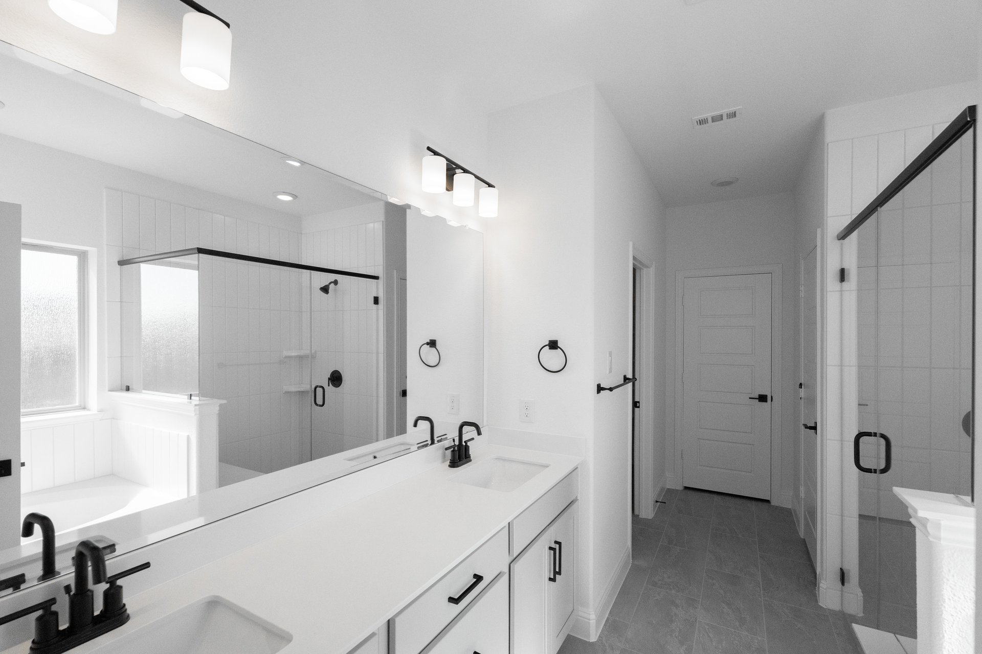 spacious primary bathroom with separate shower and tub