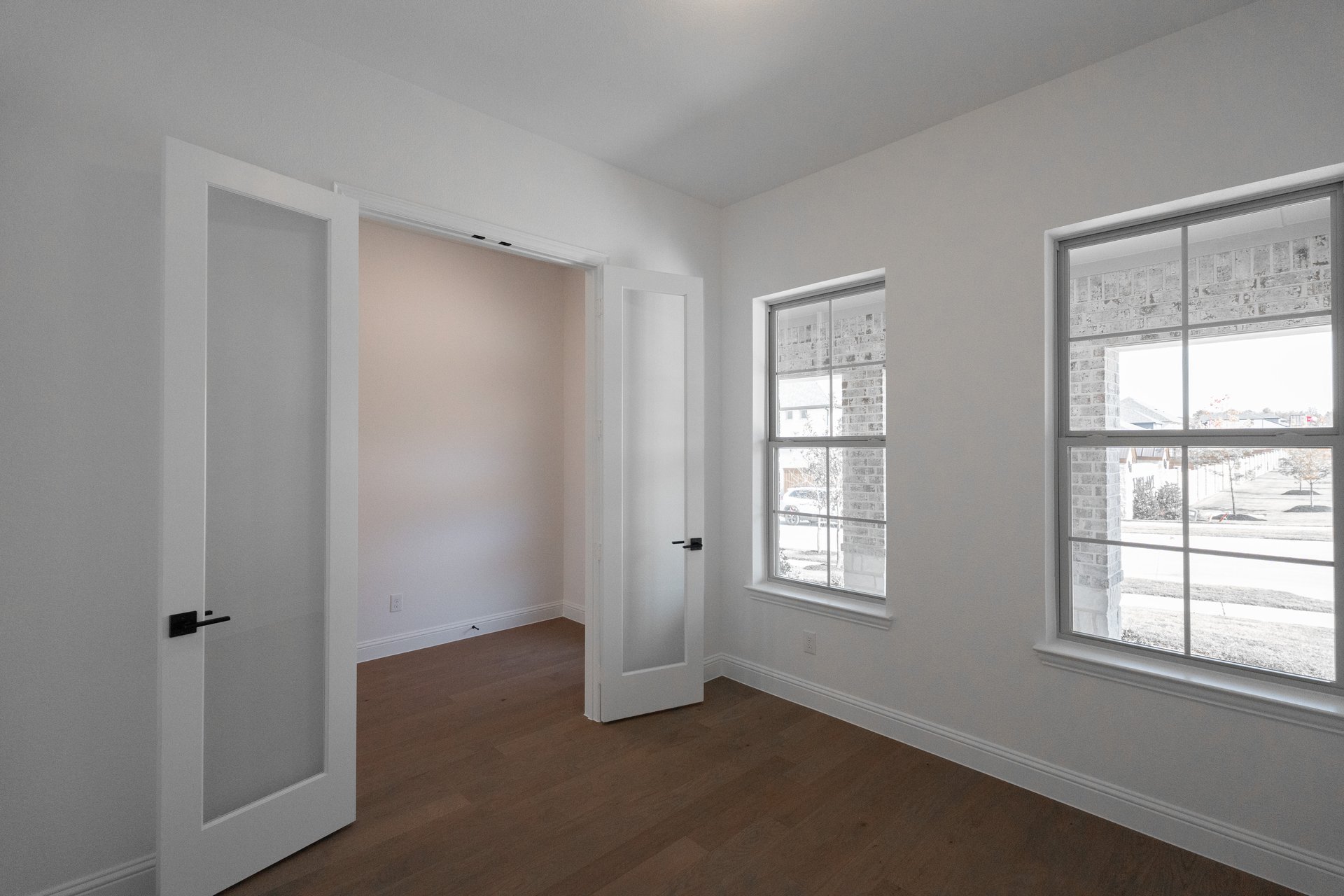 private study with hardwood flooring