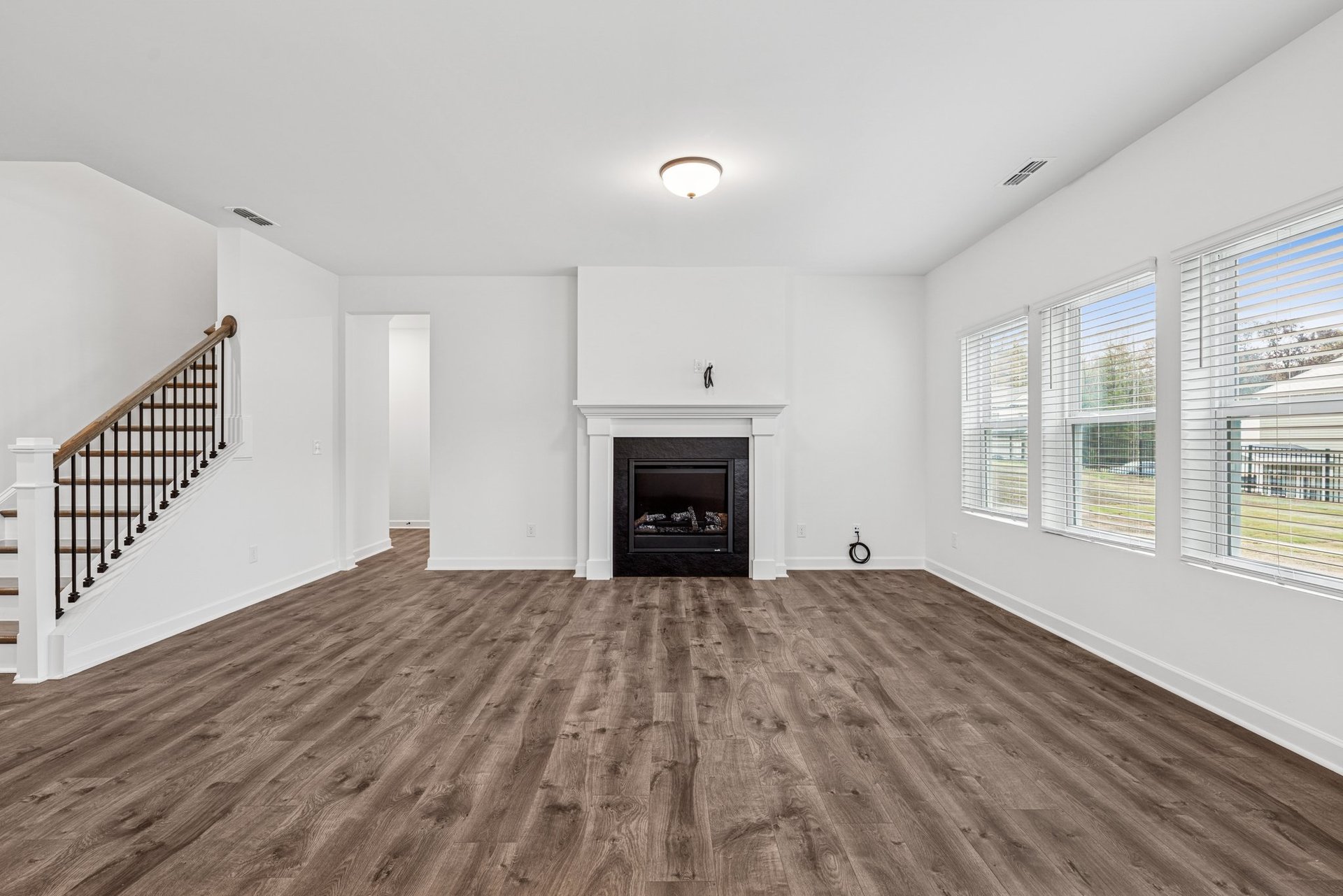 great room with windows and fireplace