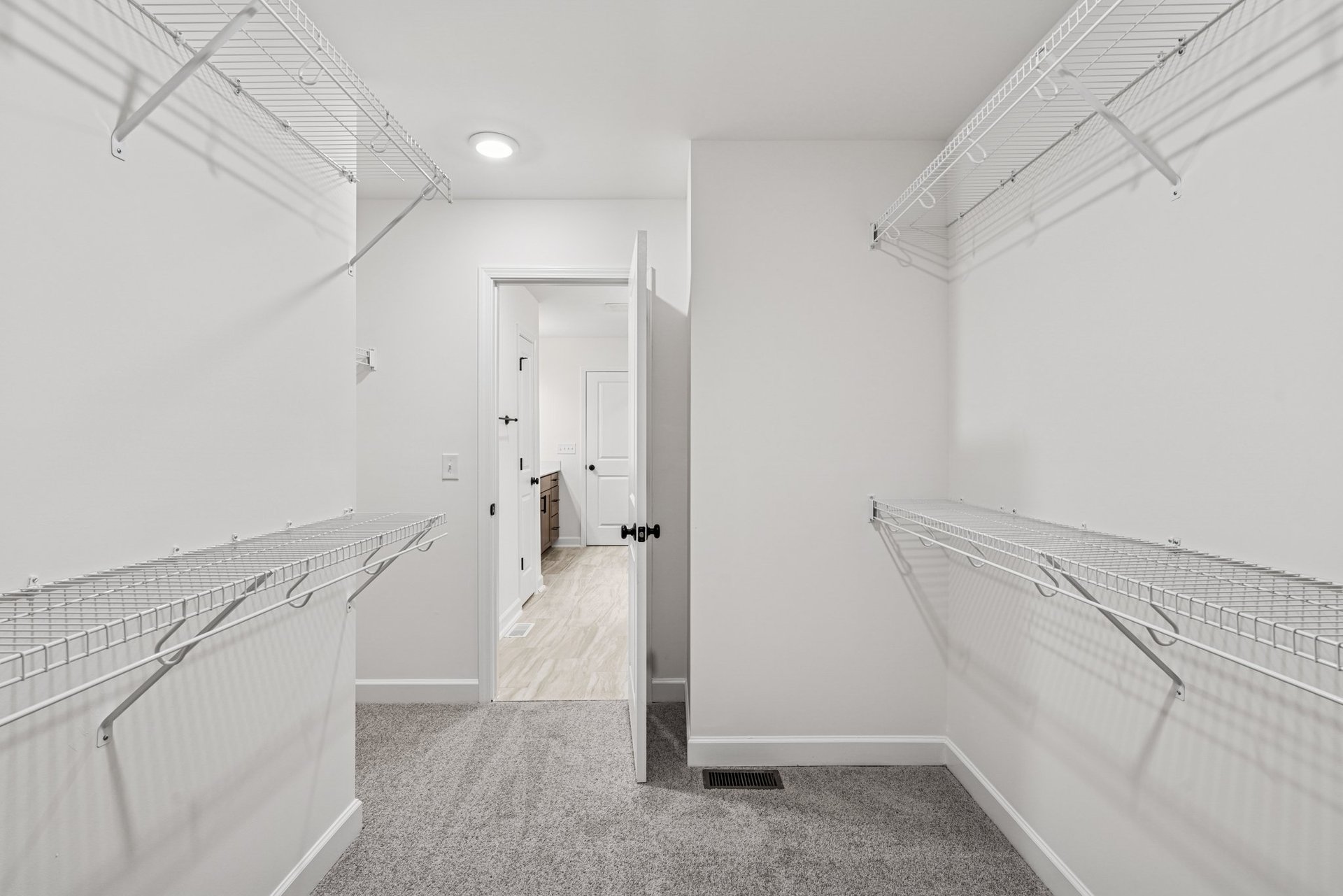 primary walk-in closet with wire shelving