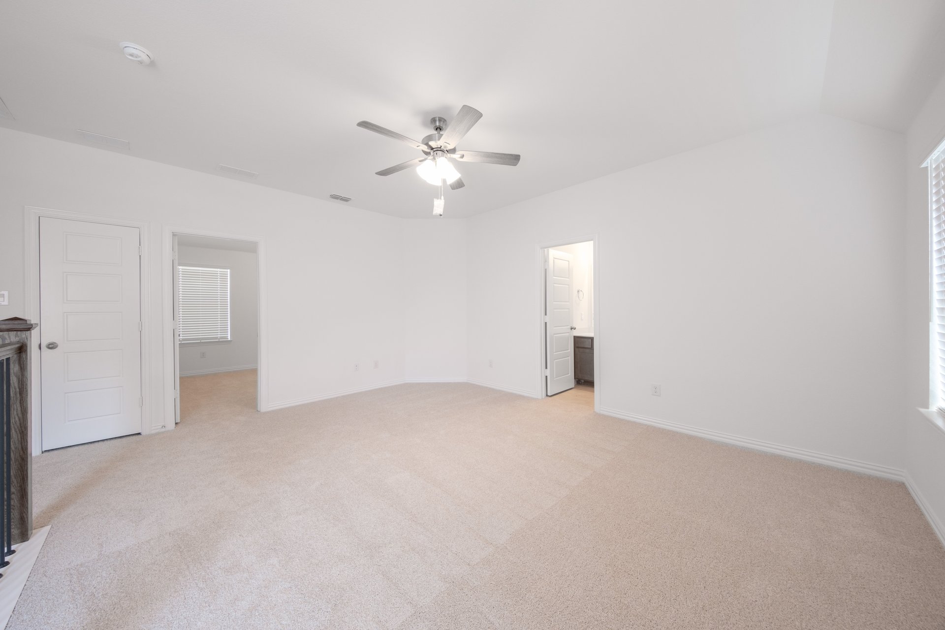 spacious loft with carpet and window