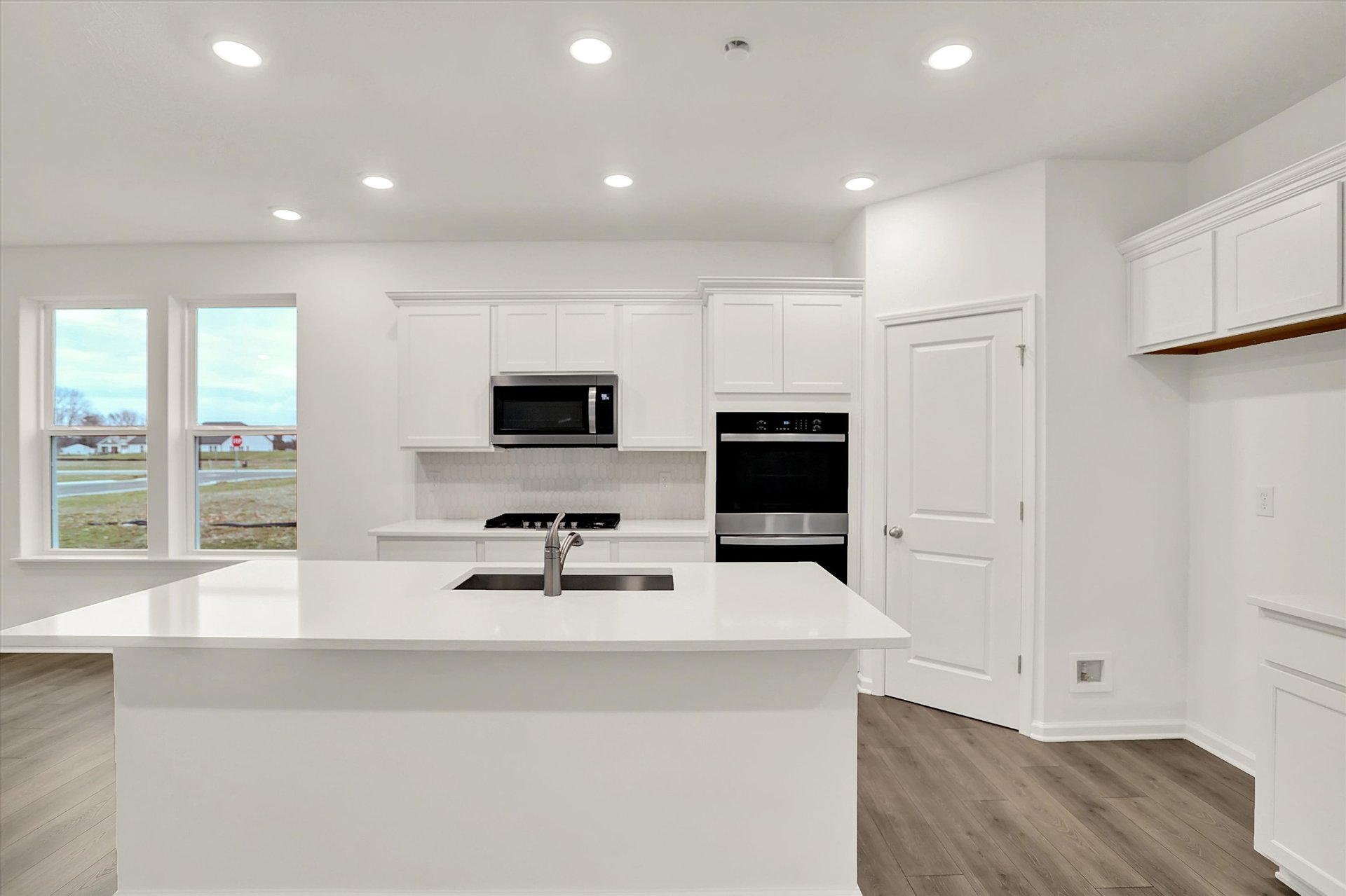 kitchen with white cabinets and countertops 
