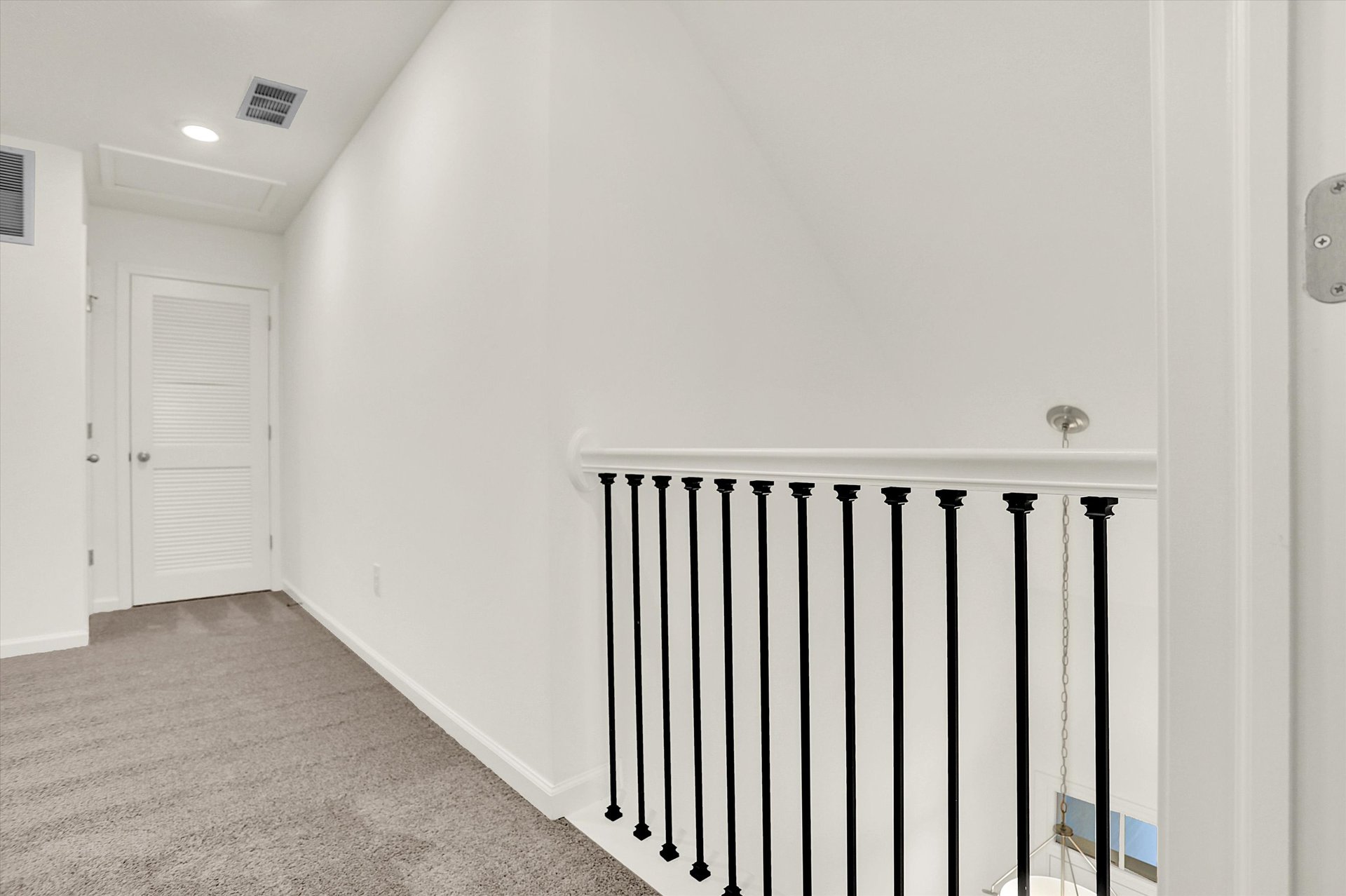 loft with open railing looking into the foyer