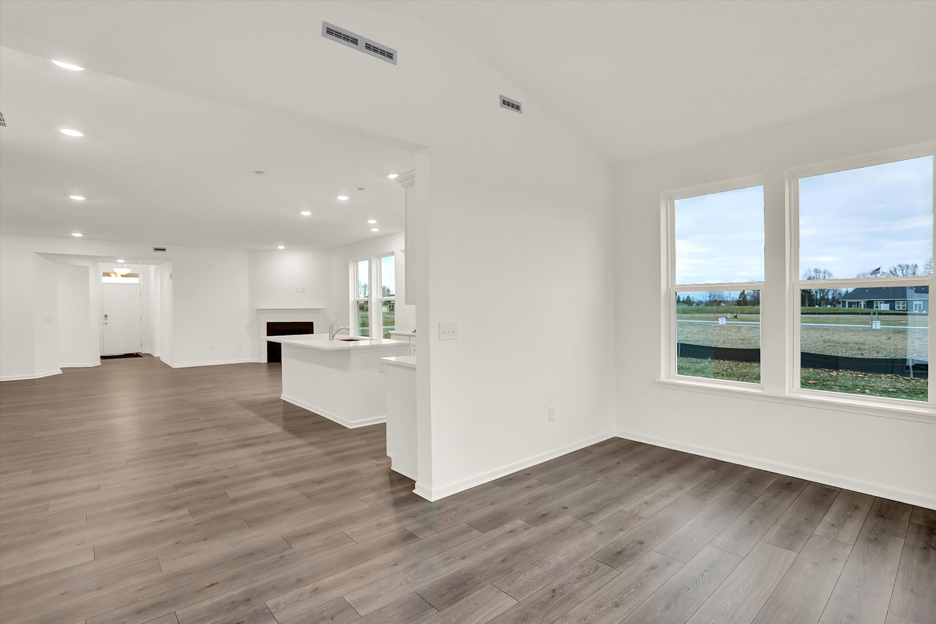 morning room with windows that is also open to the great room and kitchen