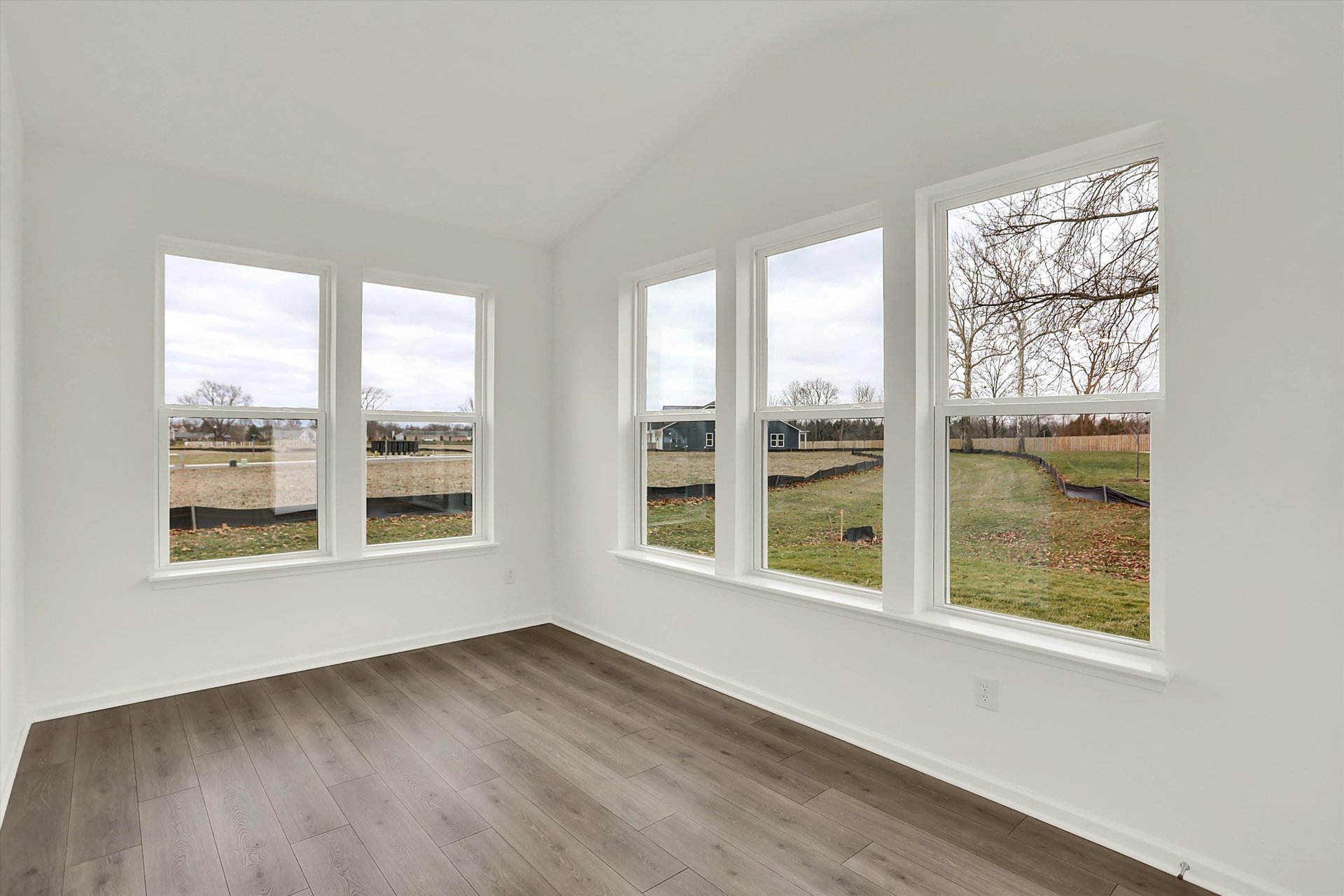 morning room with windows and white walls