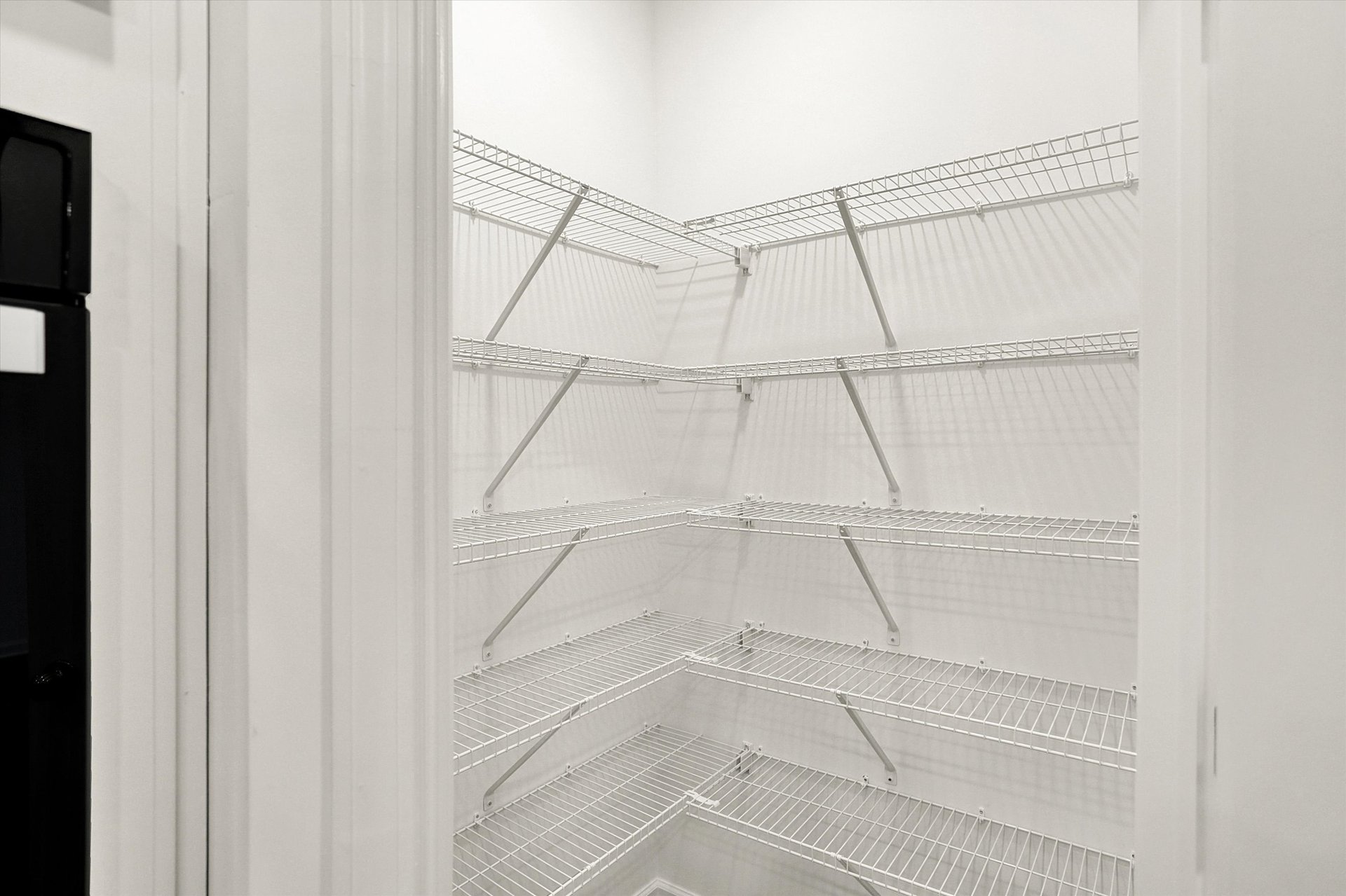 walk-in pantry with wire shelving