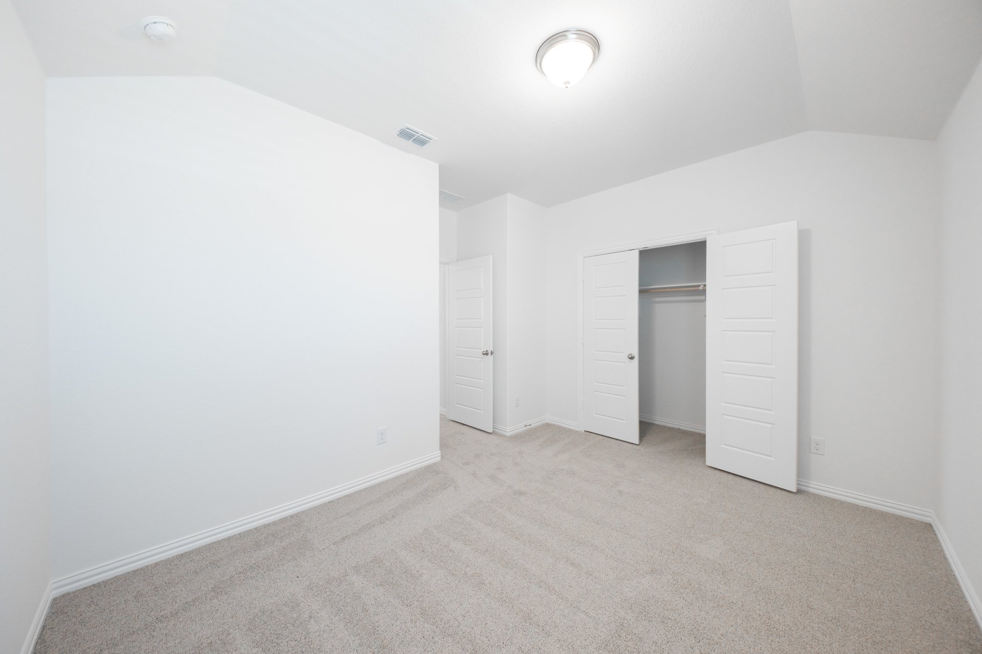 guest bedroom with carpet