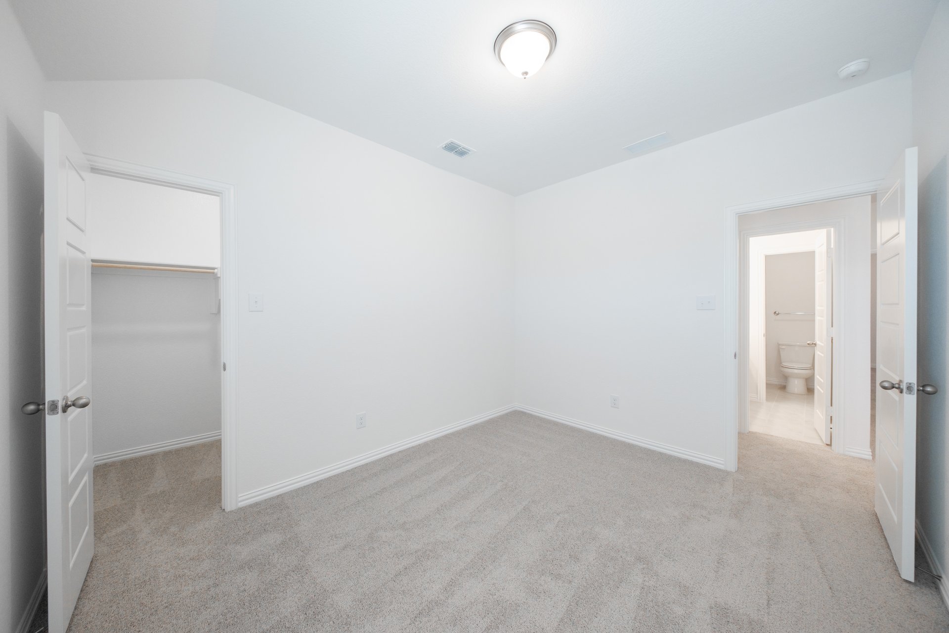 guest bedroom with carpet