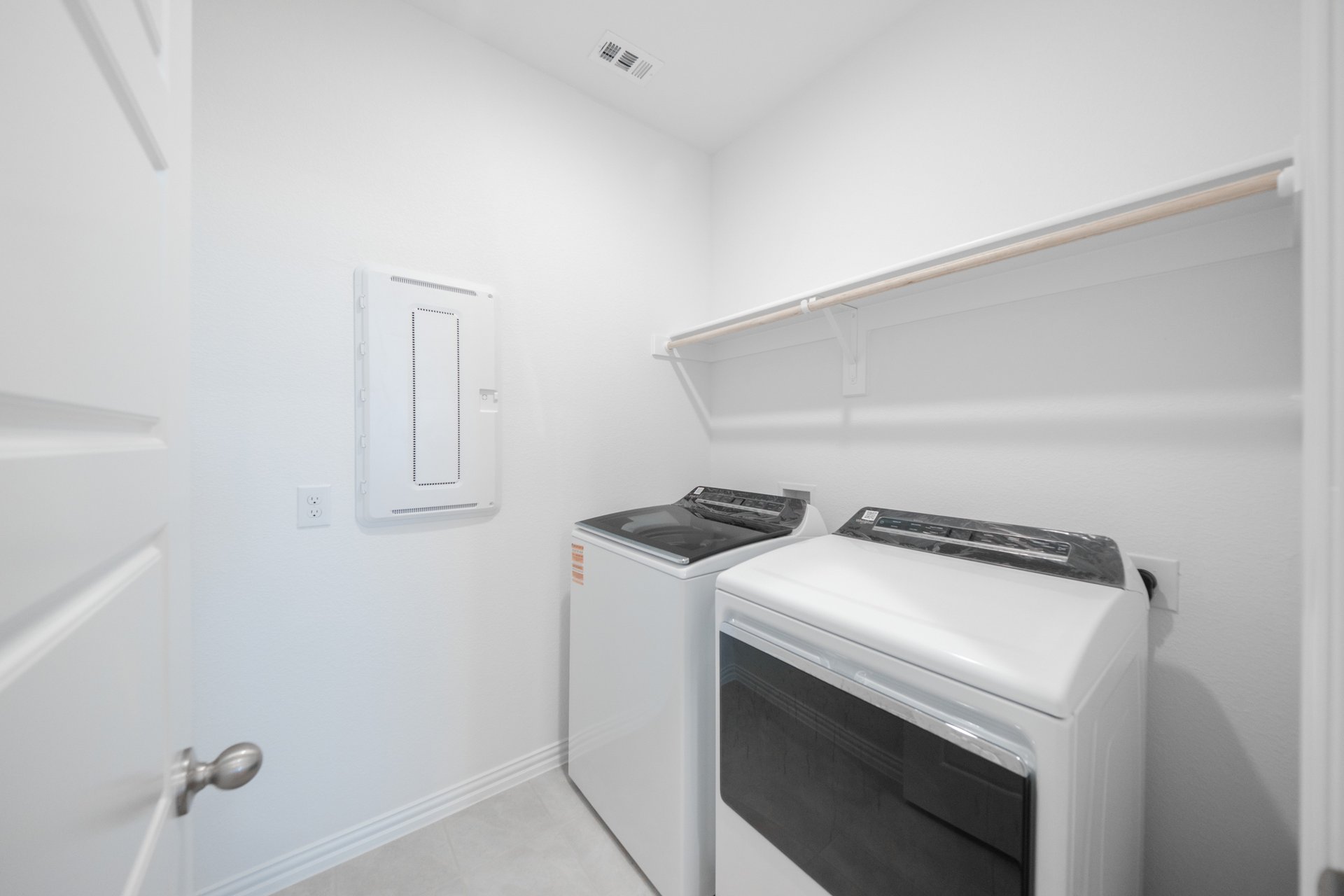 laundry room with included washer and dryer