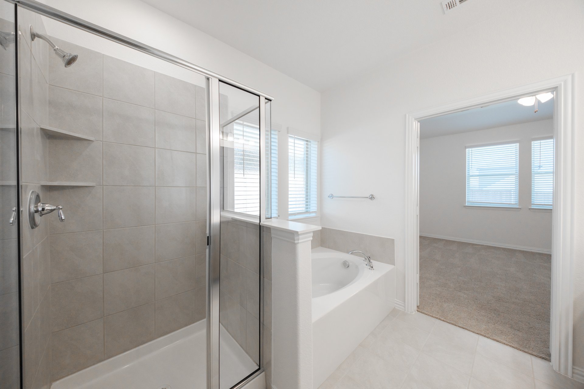 primary bathroom with soaking tub and walk-in shower