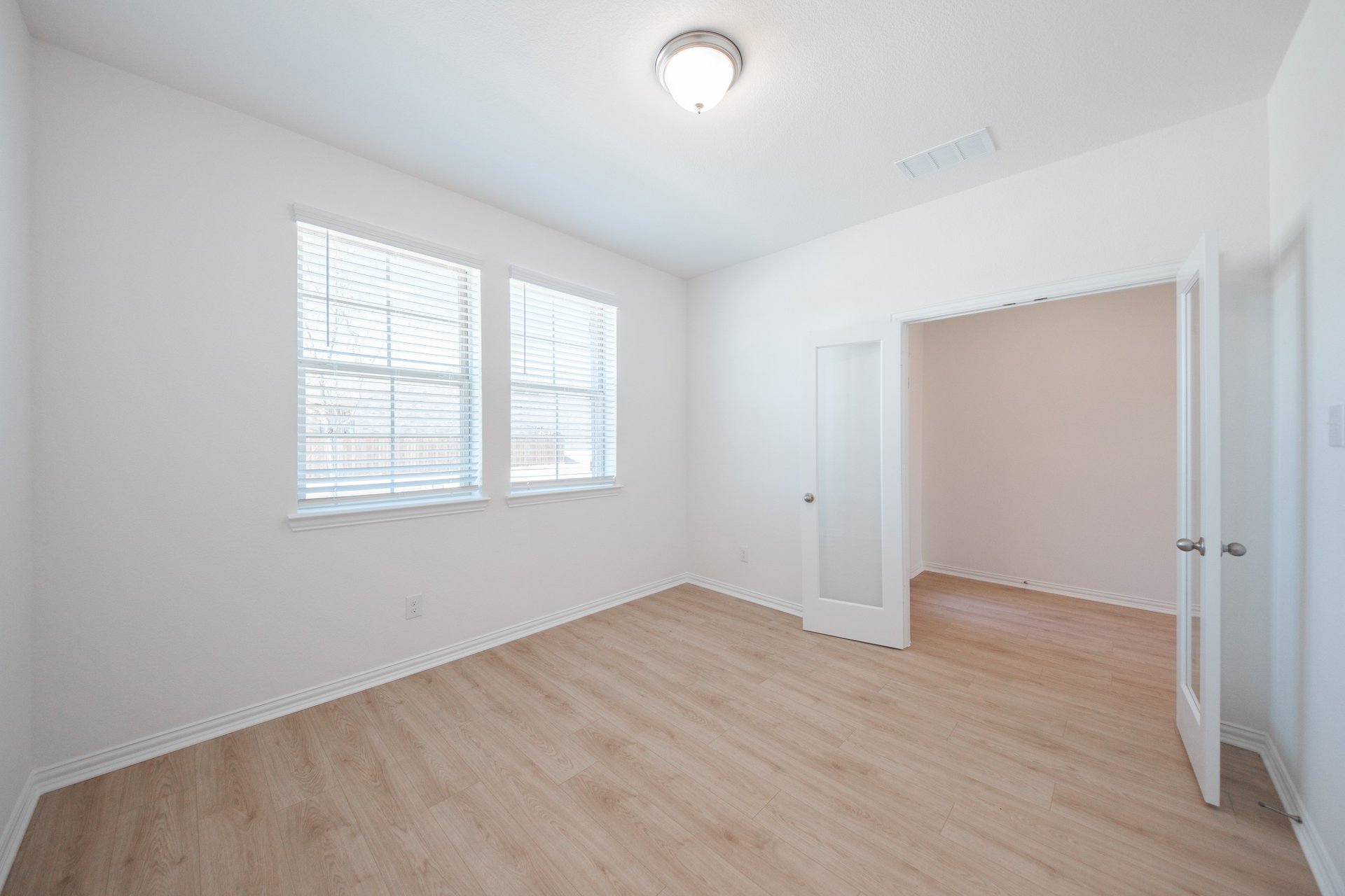 private study with hardwood flooring