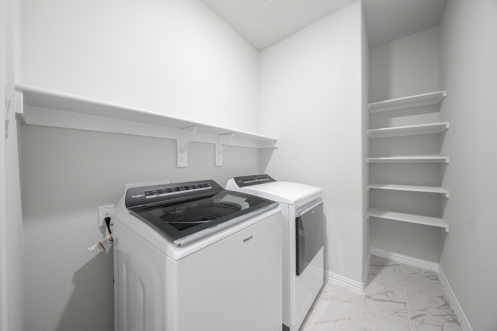 laundry room with included washer and dryer