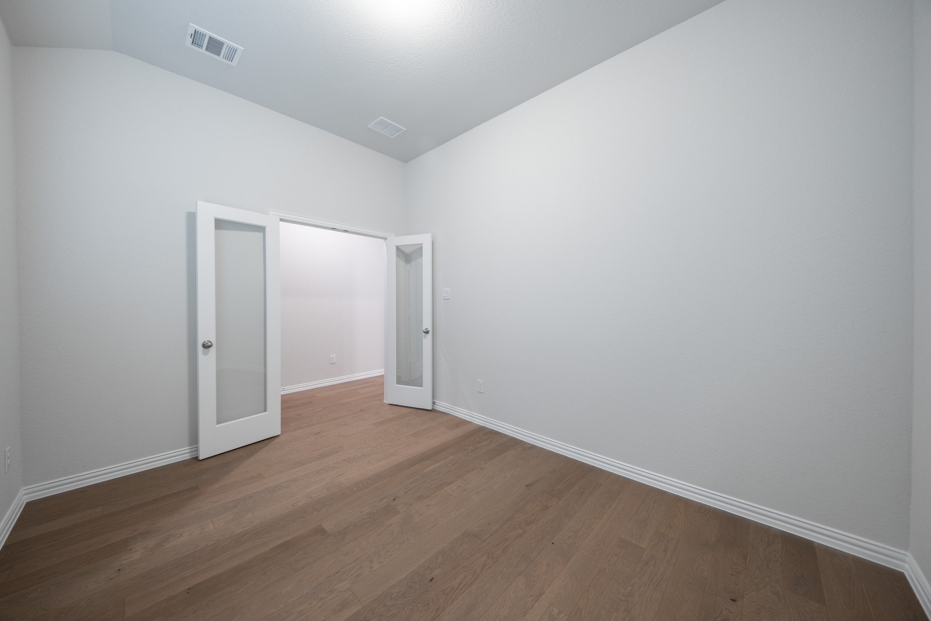 private study with hardwood flooring