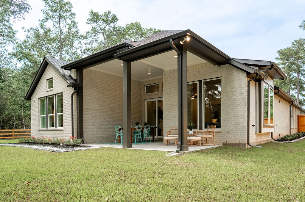 exterior rear patio with outdoor furniture 