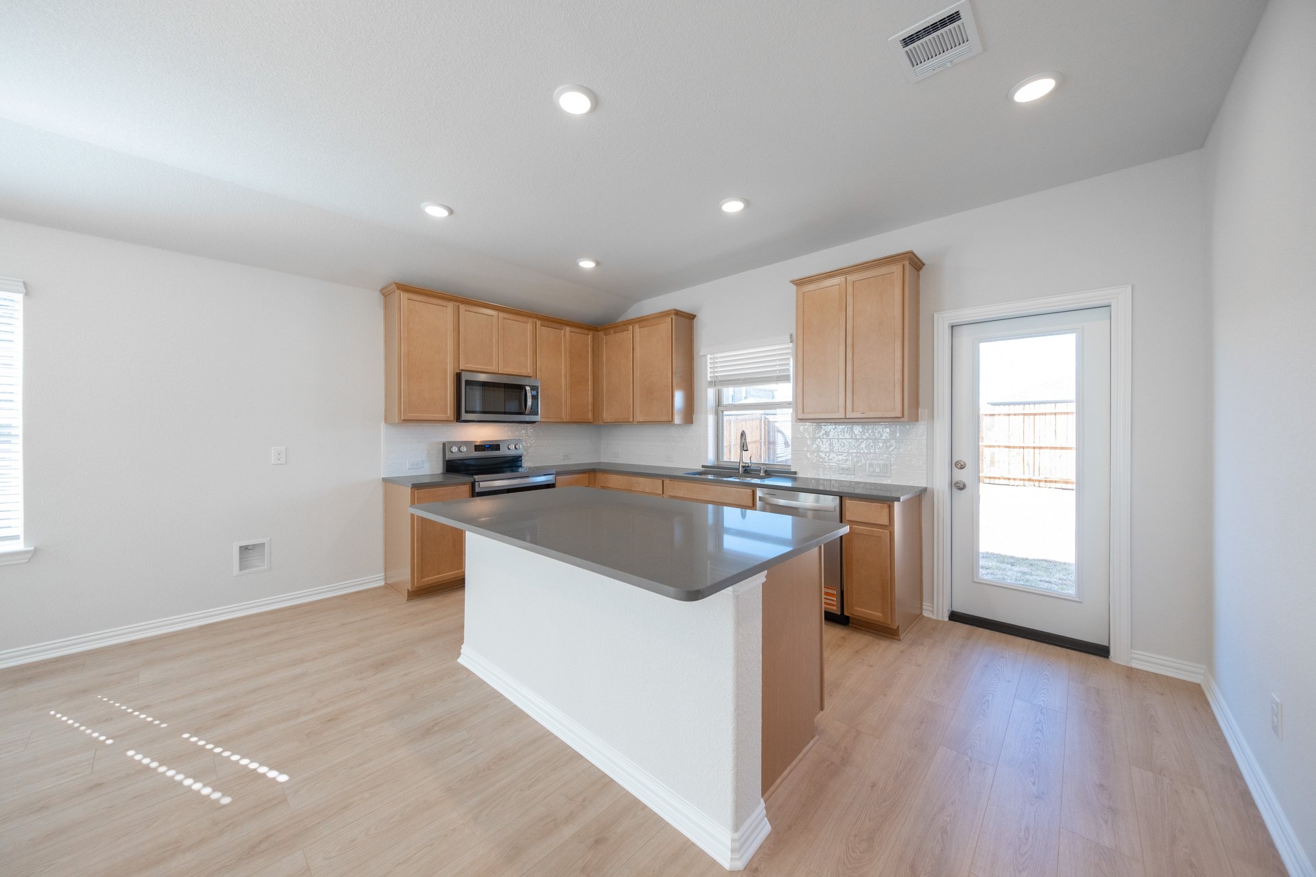 kitchen with large island and wood floors 