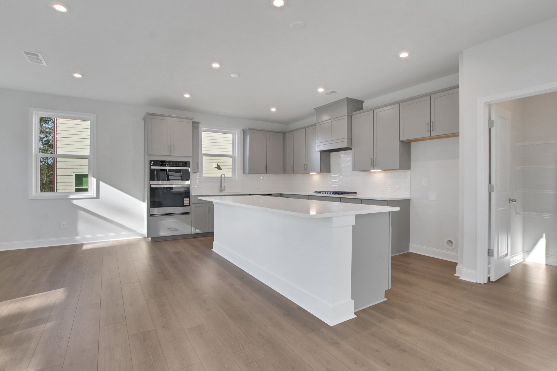 kitchen with gray cabinets and white quartz counters