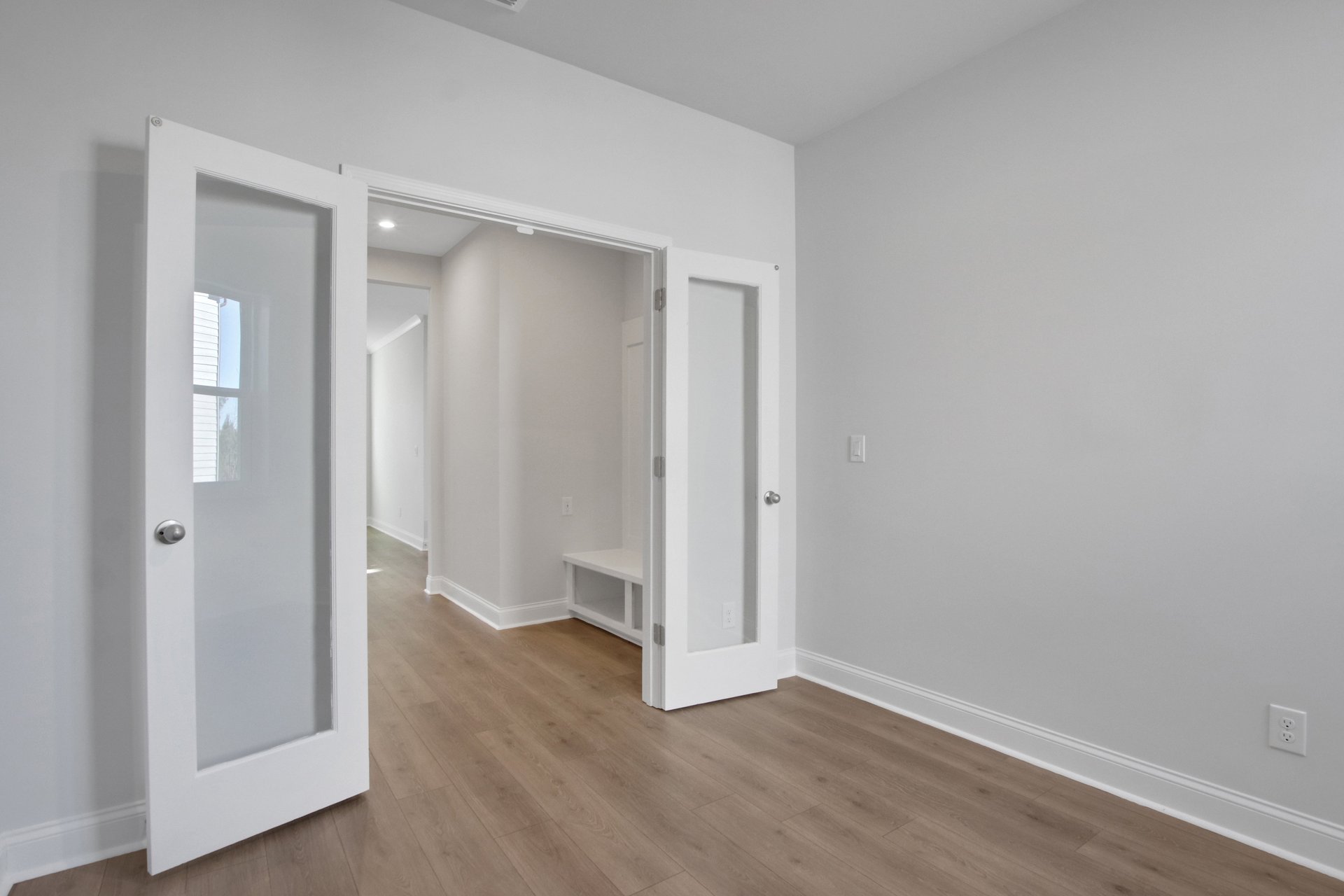 study with french doors and hard surface flooring