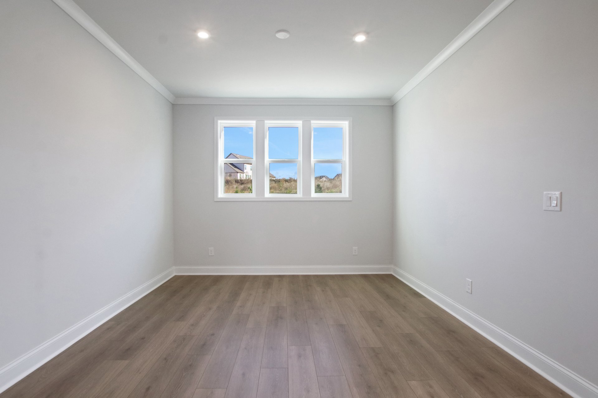 dining room with hard surface flooring and windows