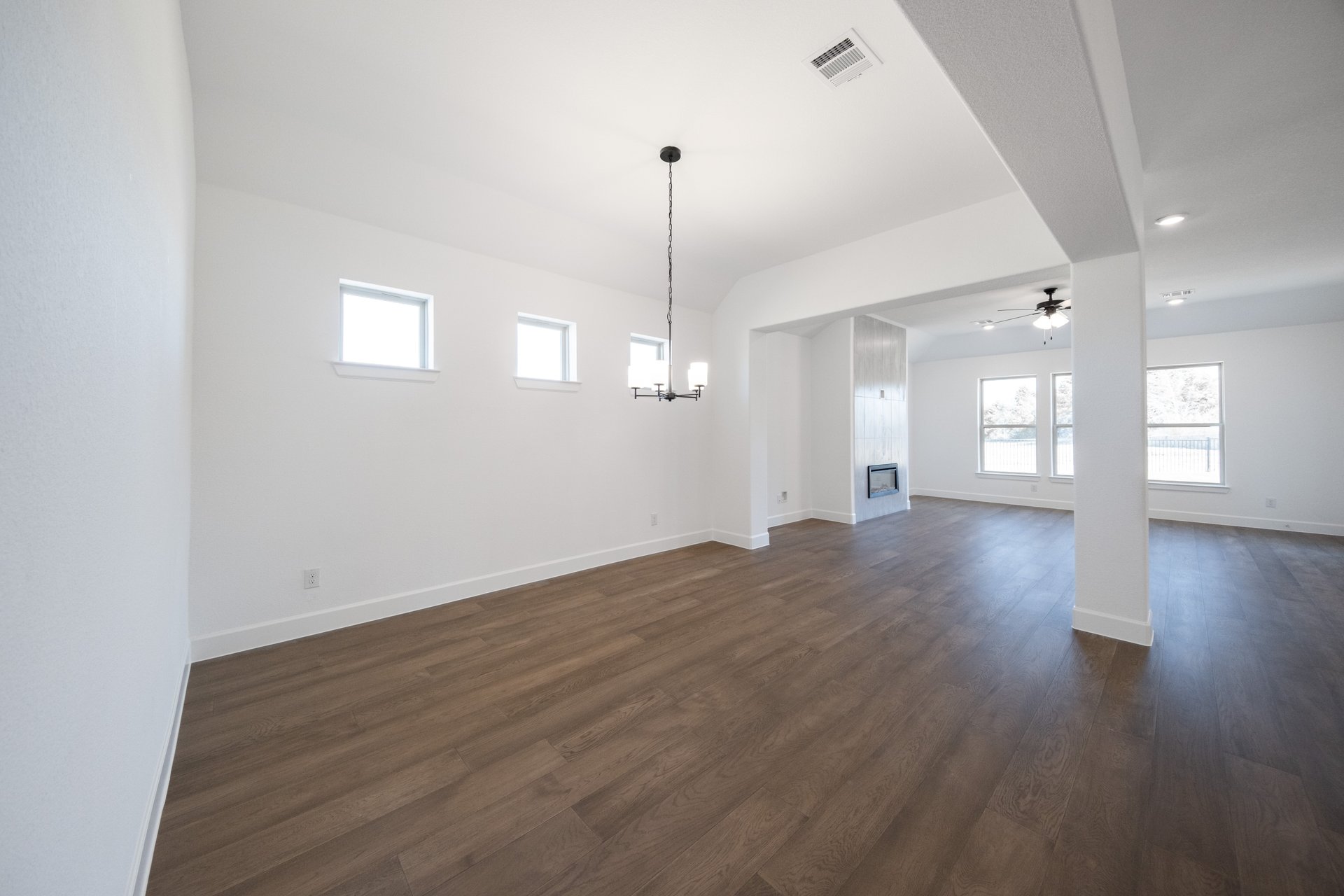 dining room with wood flooring and chandelier 