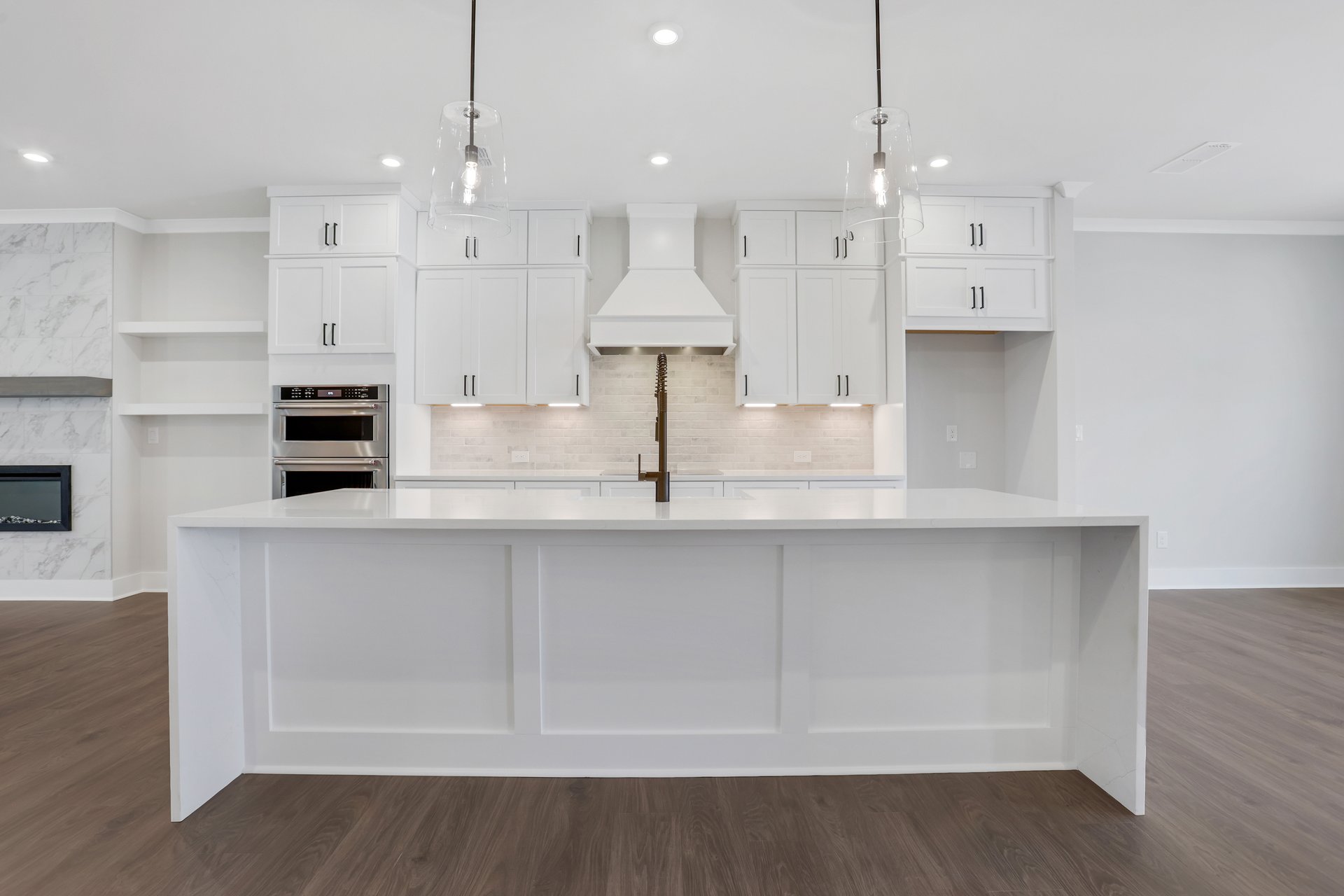 kitchen with white cabinets and quartz counters
