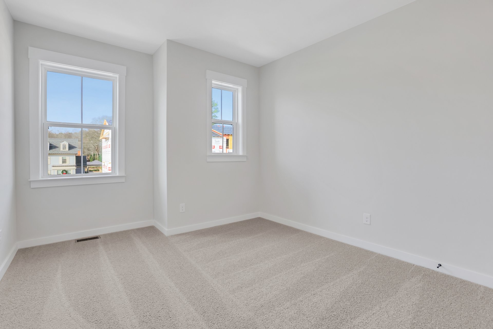 bedroom with carpet and windows