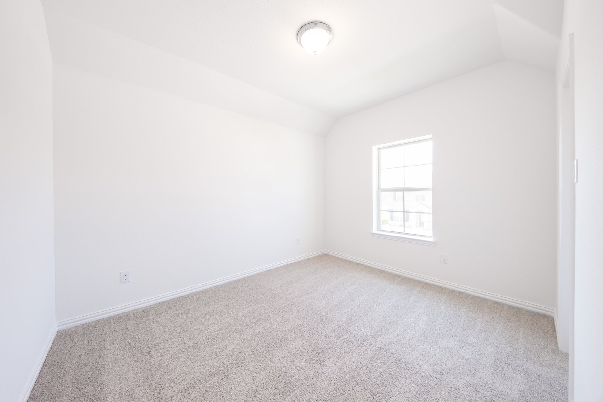 bedroom with carpet and window