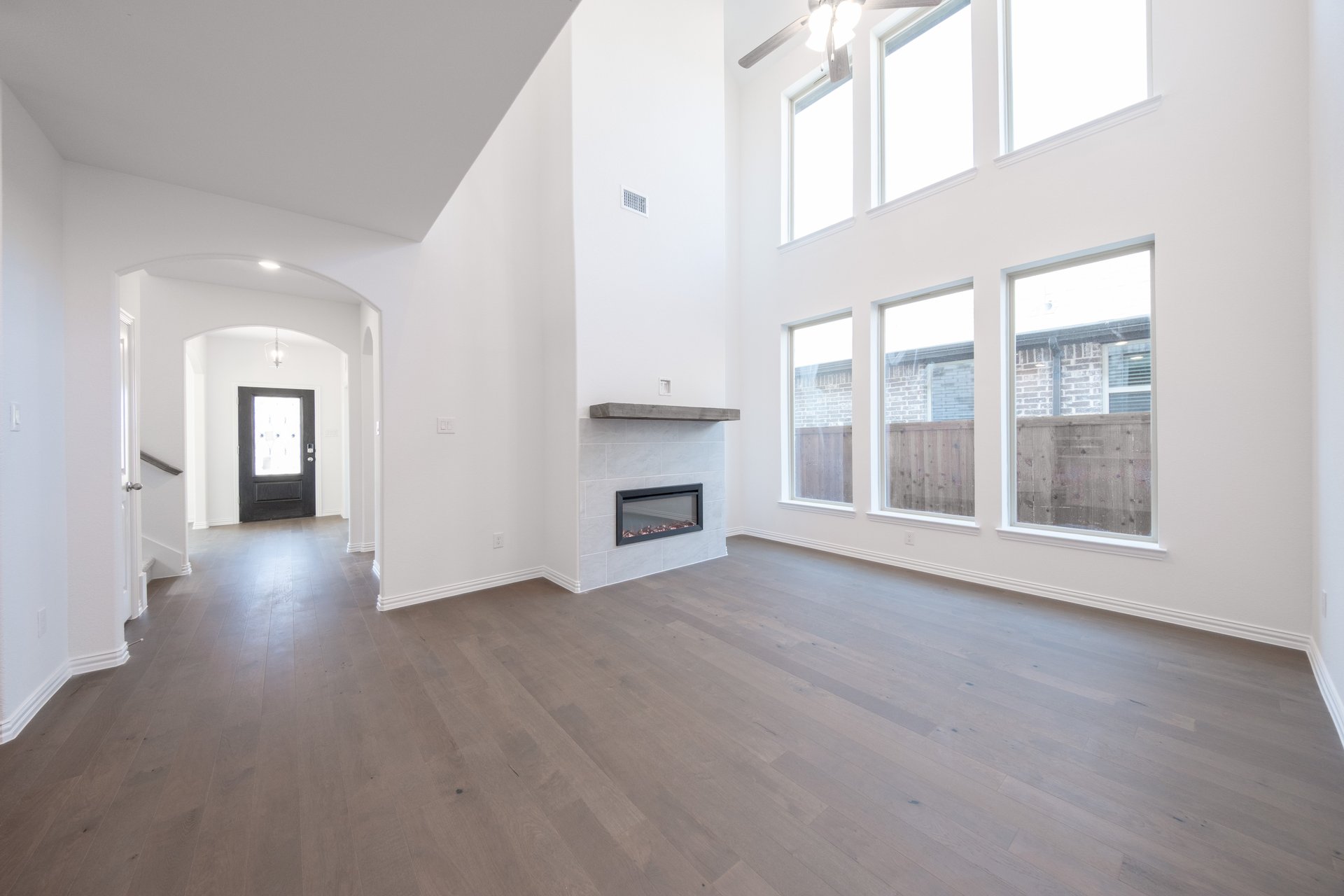 great room with high ceilings and fireplace 