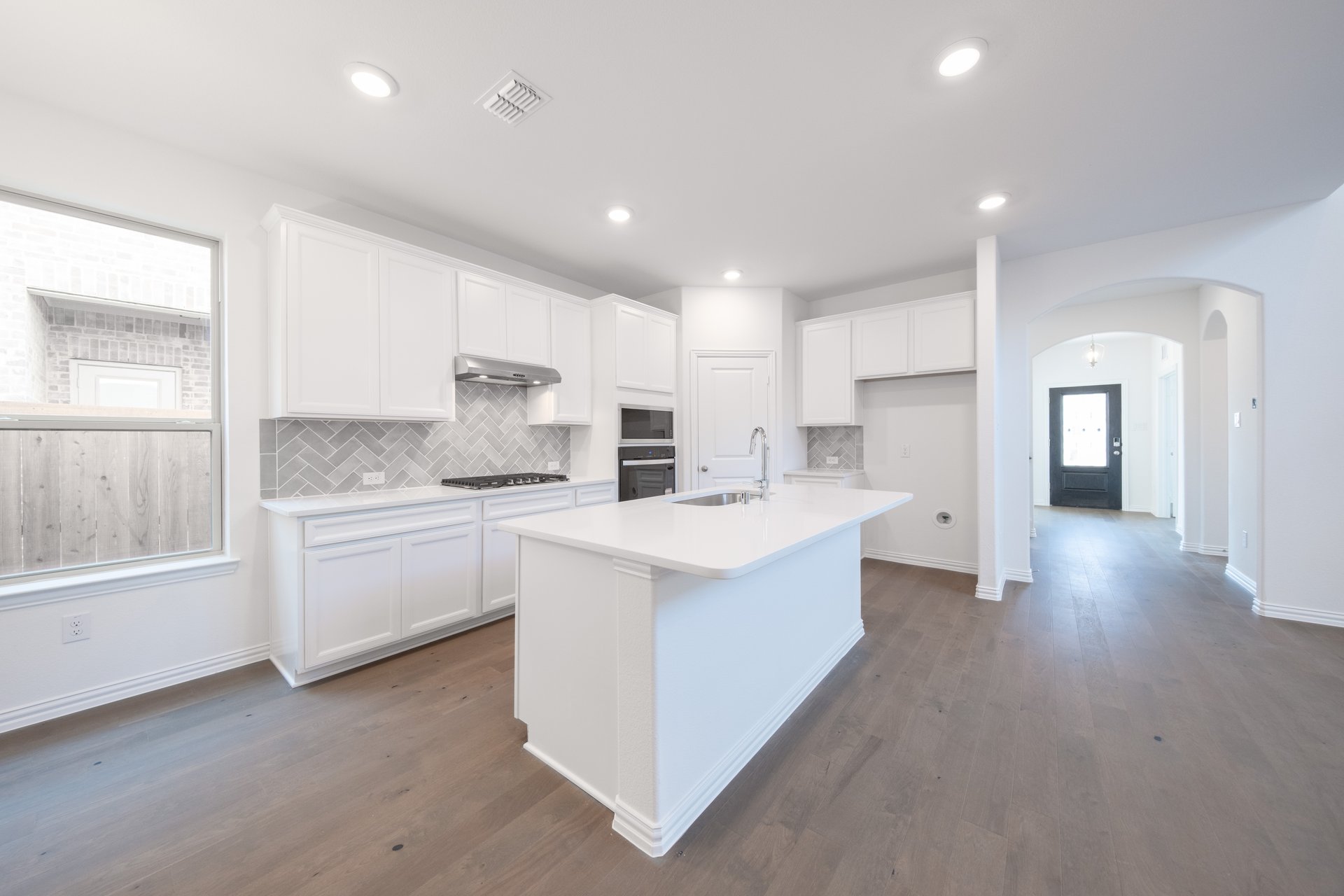 kitchen with large island and white cabinets 