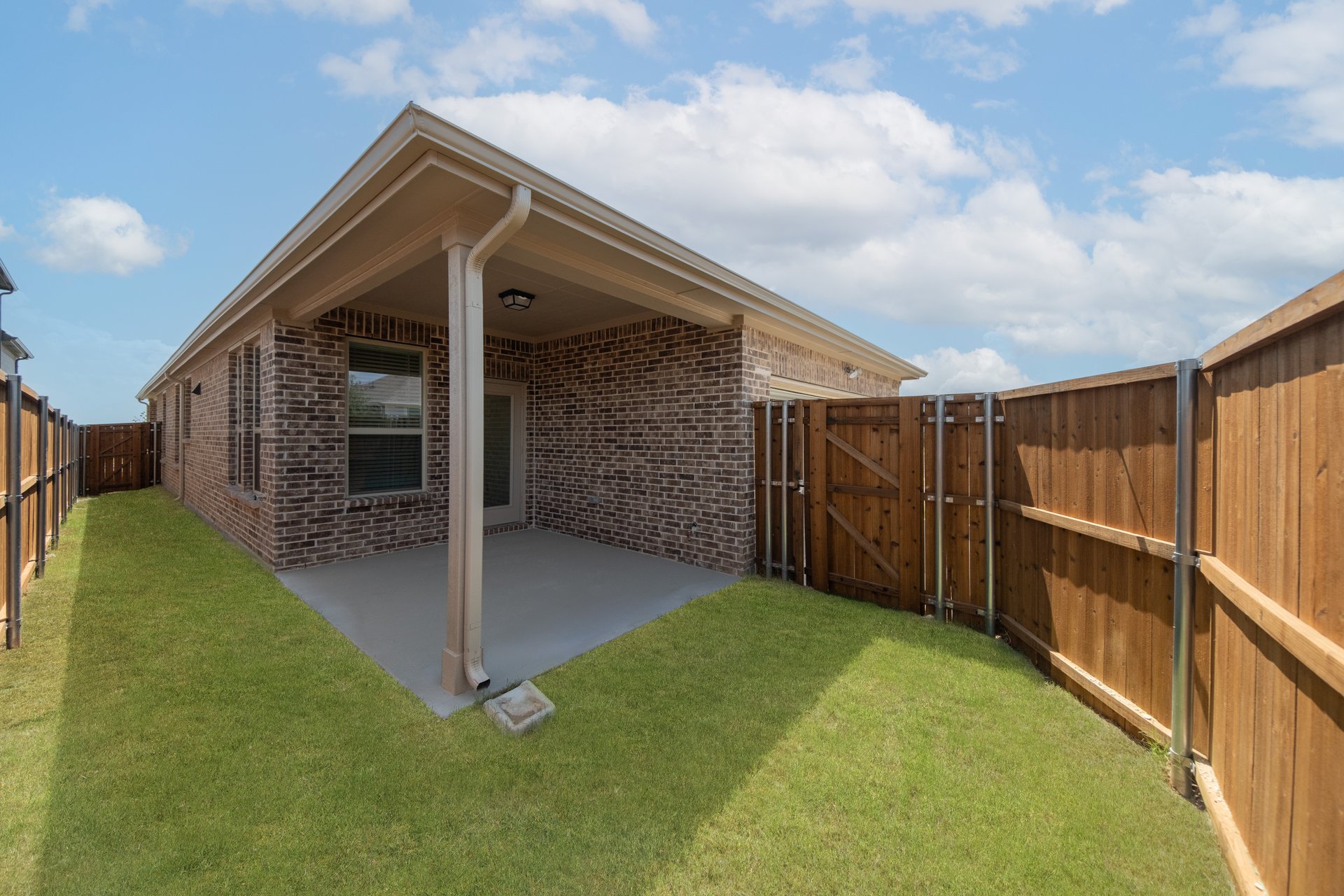 backyard of home with covered patio