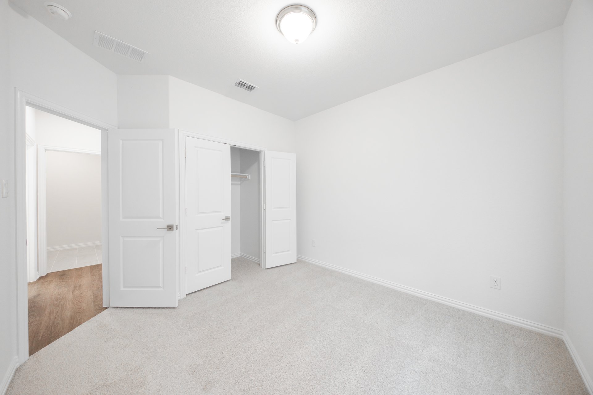 guest bedroom with carpet