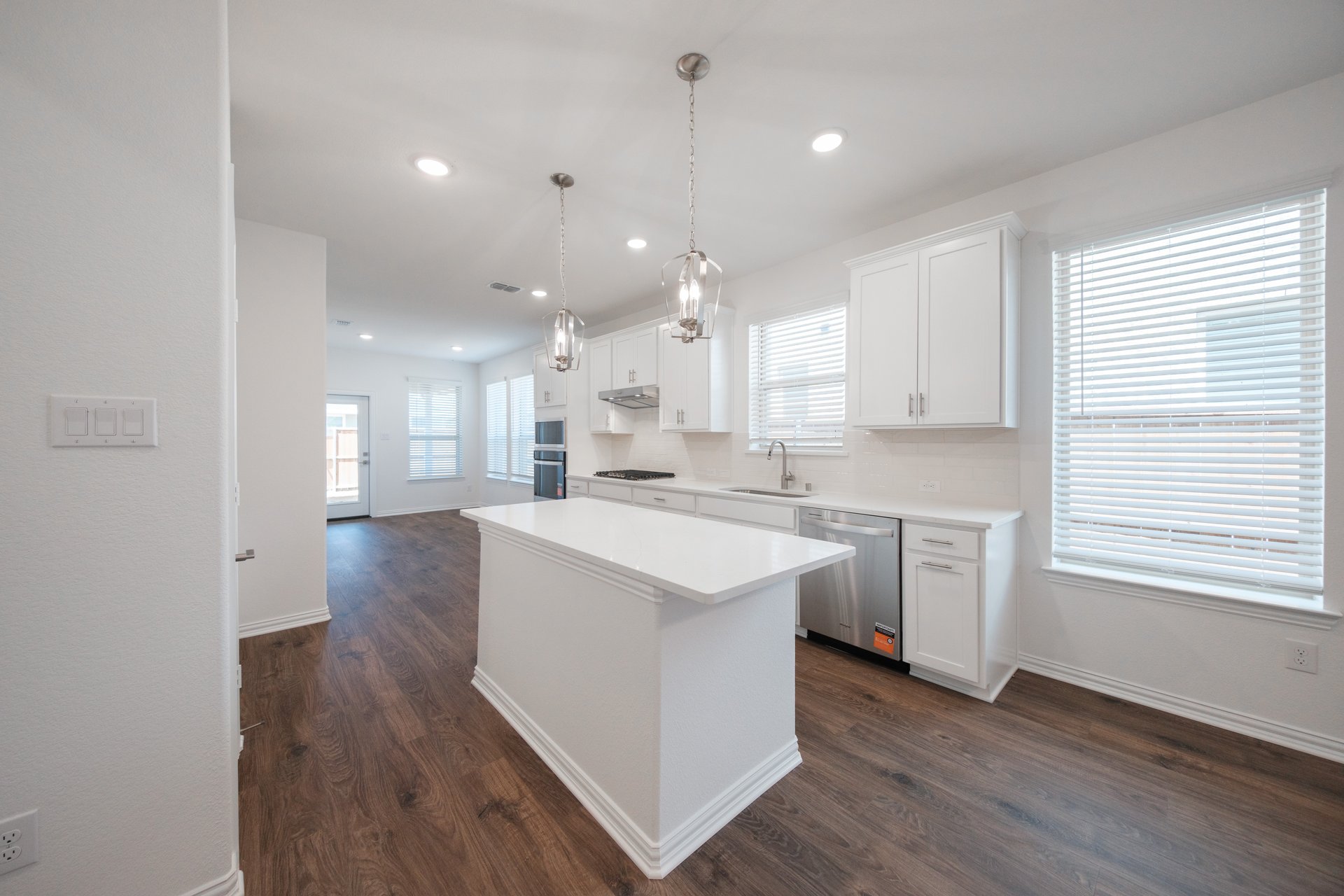 open kitchen with white cabinets