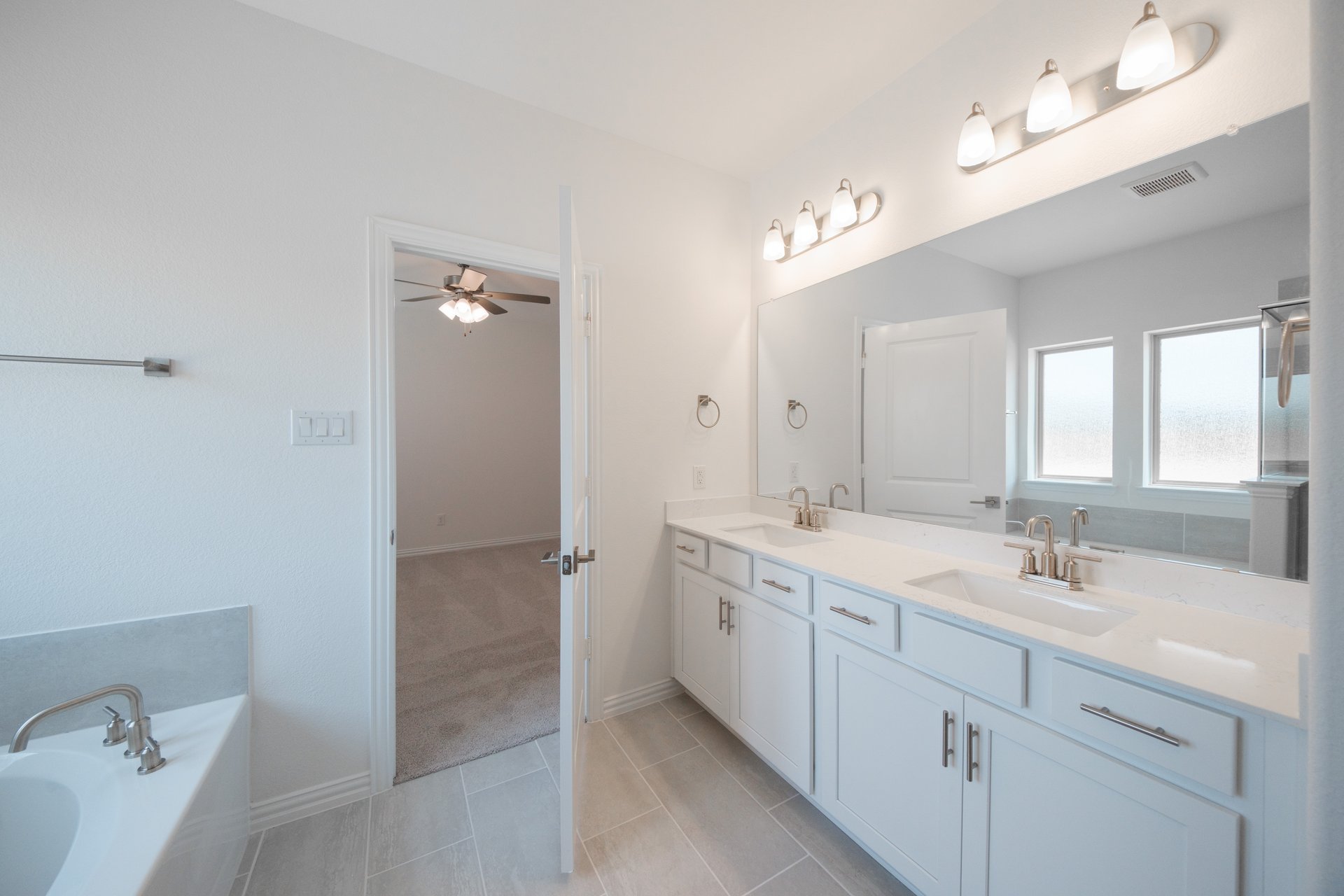 primary bathroom with soaking tub and walk-in shower