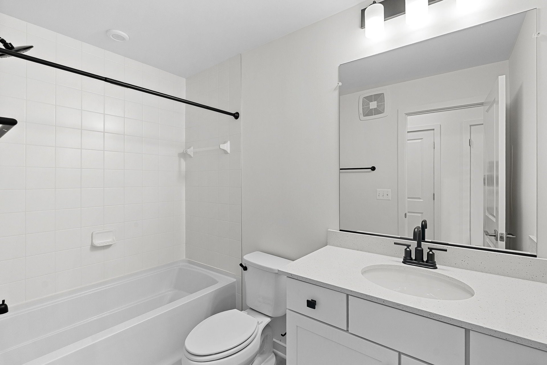 secondary bath with a shower and tub combination