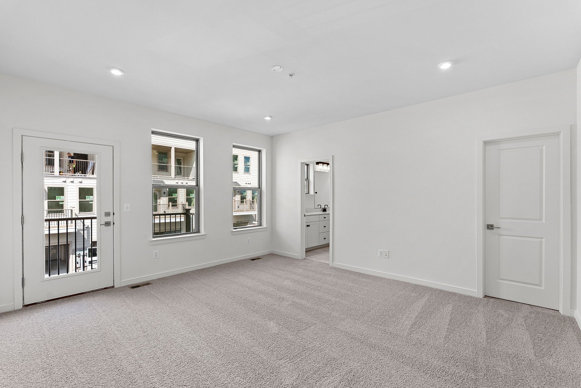 primary bedroom with a view of the deck