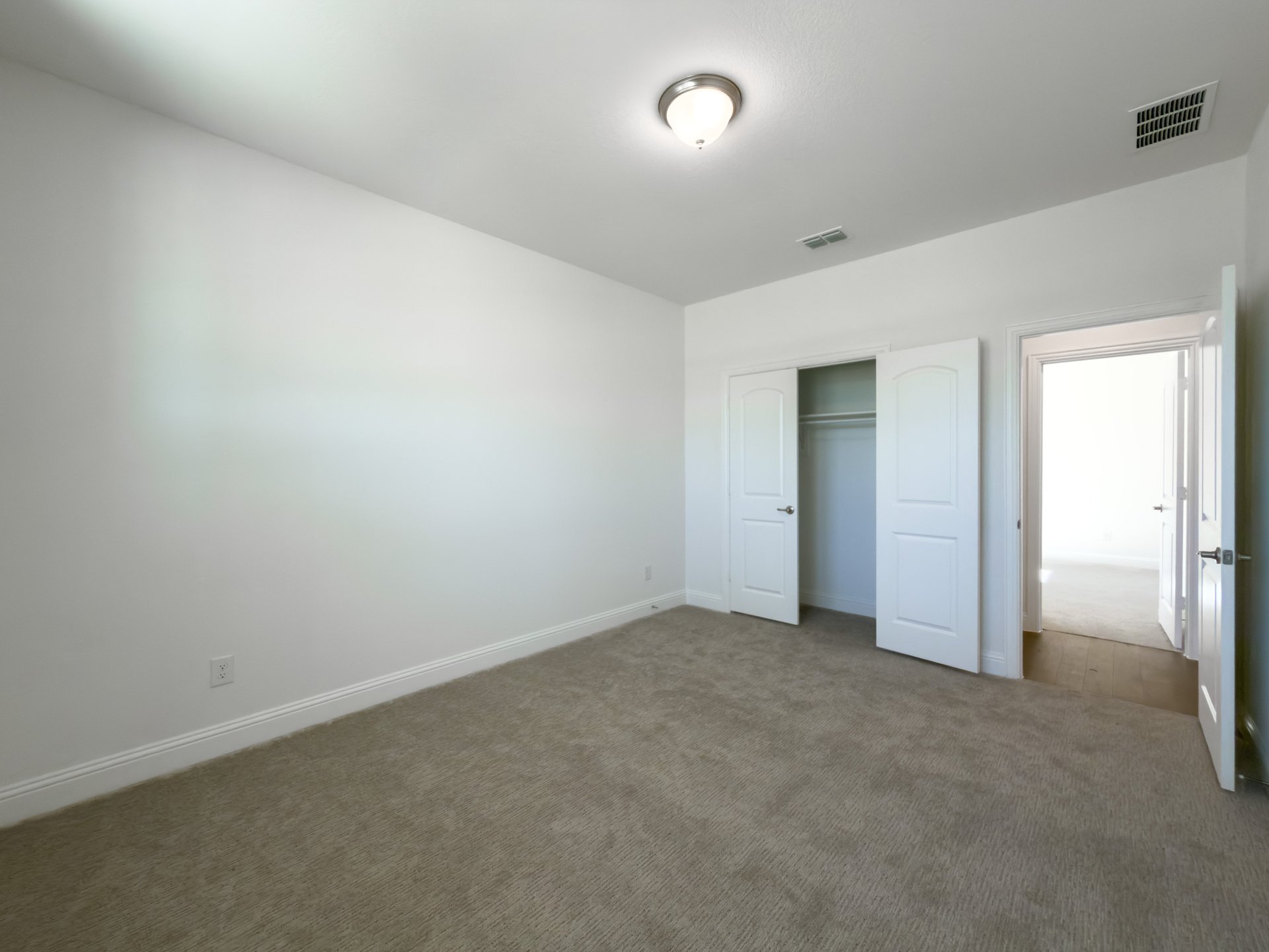 guest bedroom with carpet