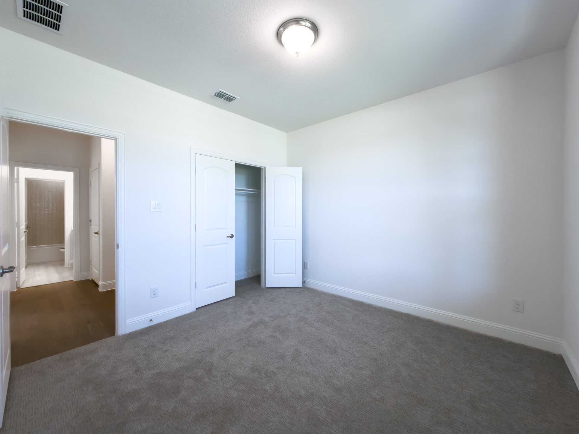 guest bedroom with carpet