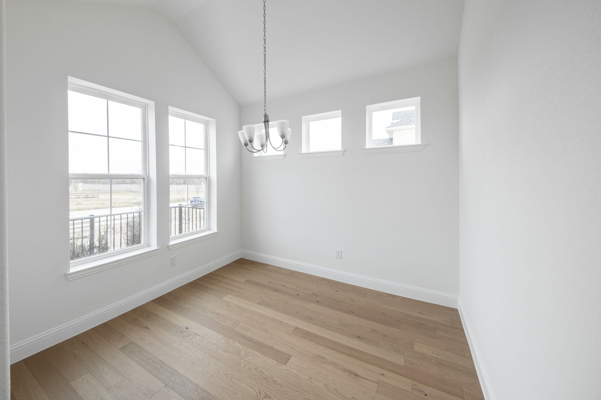 dining room with large windows and wood flooring