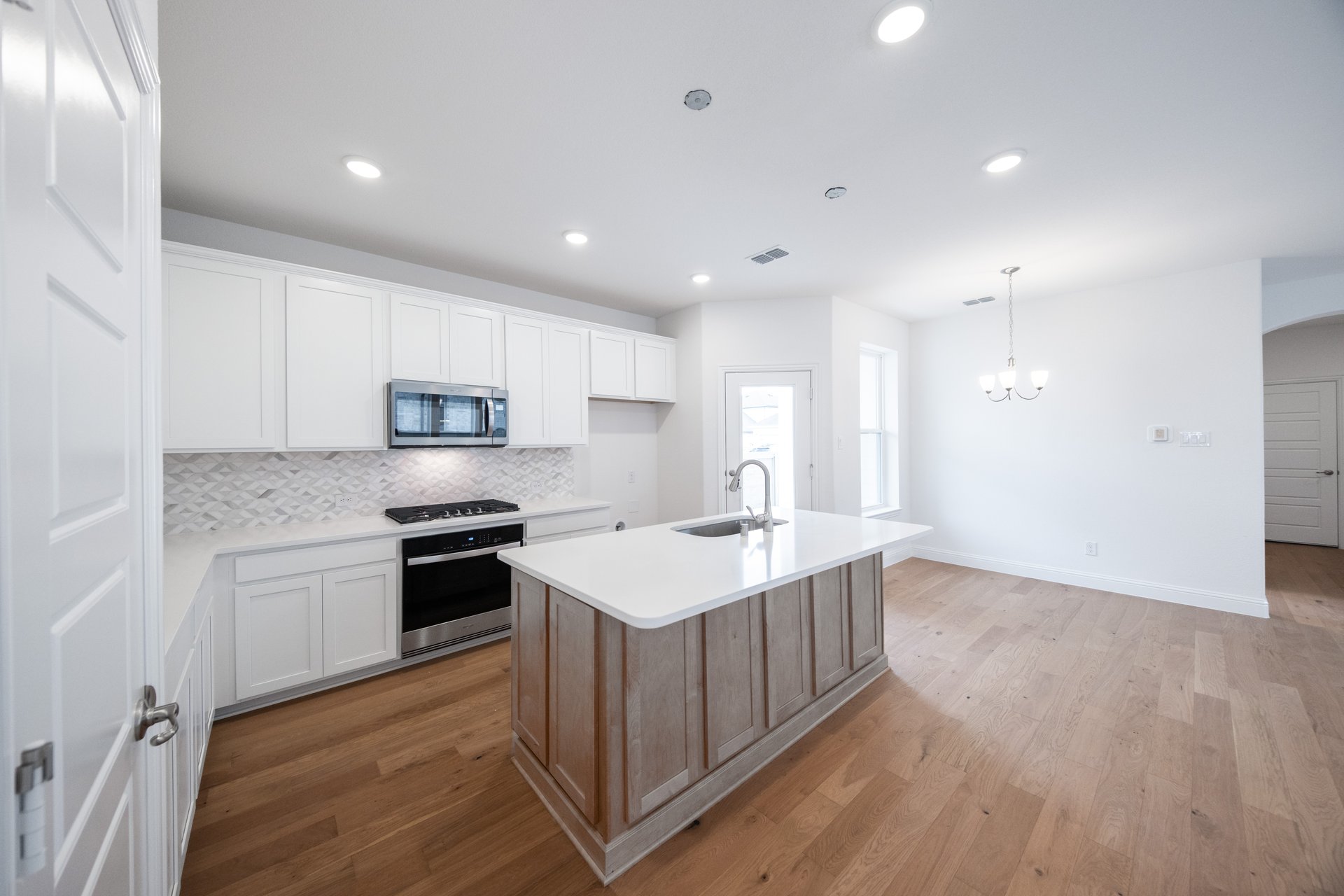 kitchen with large island and white countertops