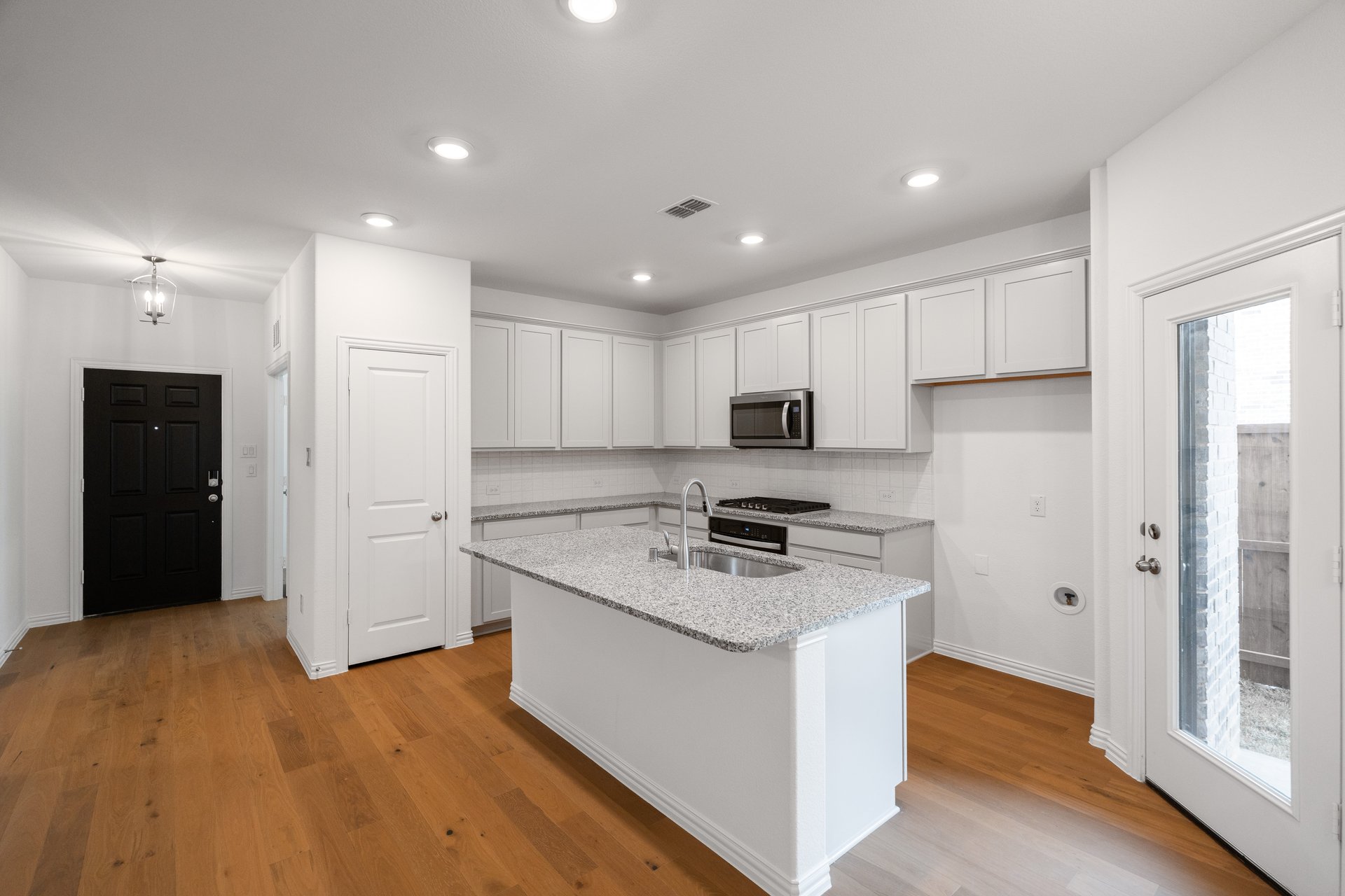 kitchen with large island and wood flooring
