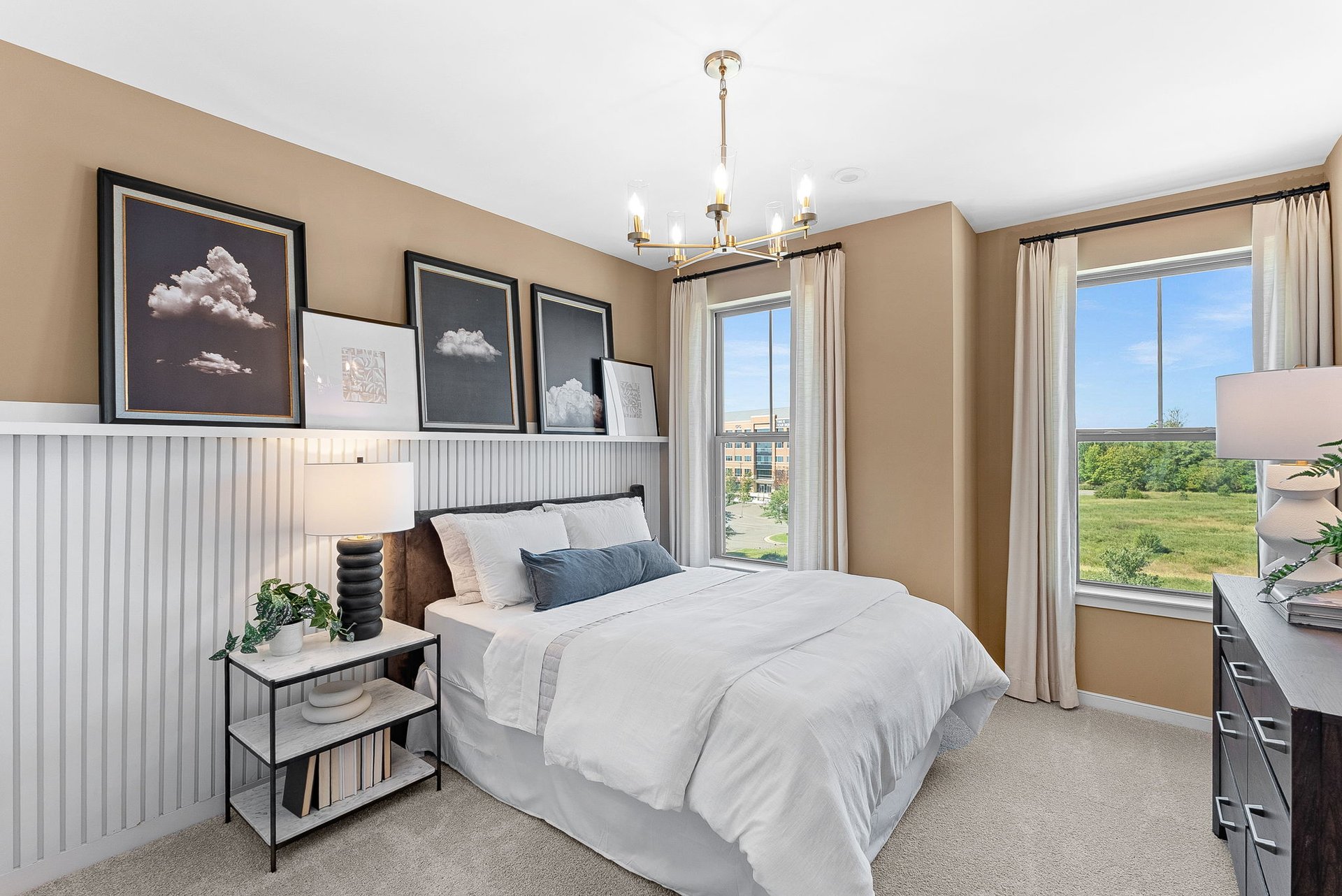 secondary bedroom with carpet and two windows