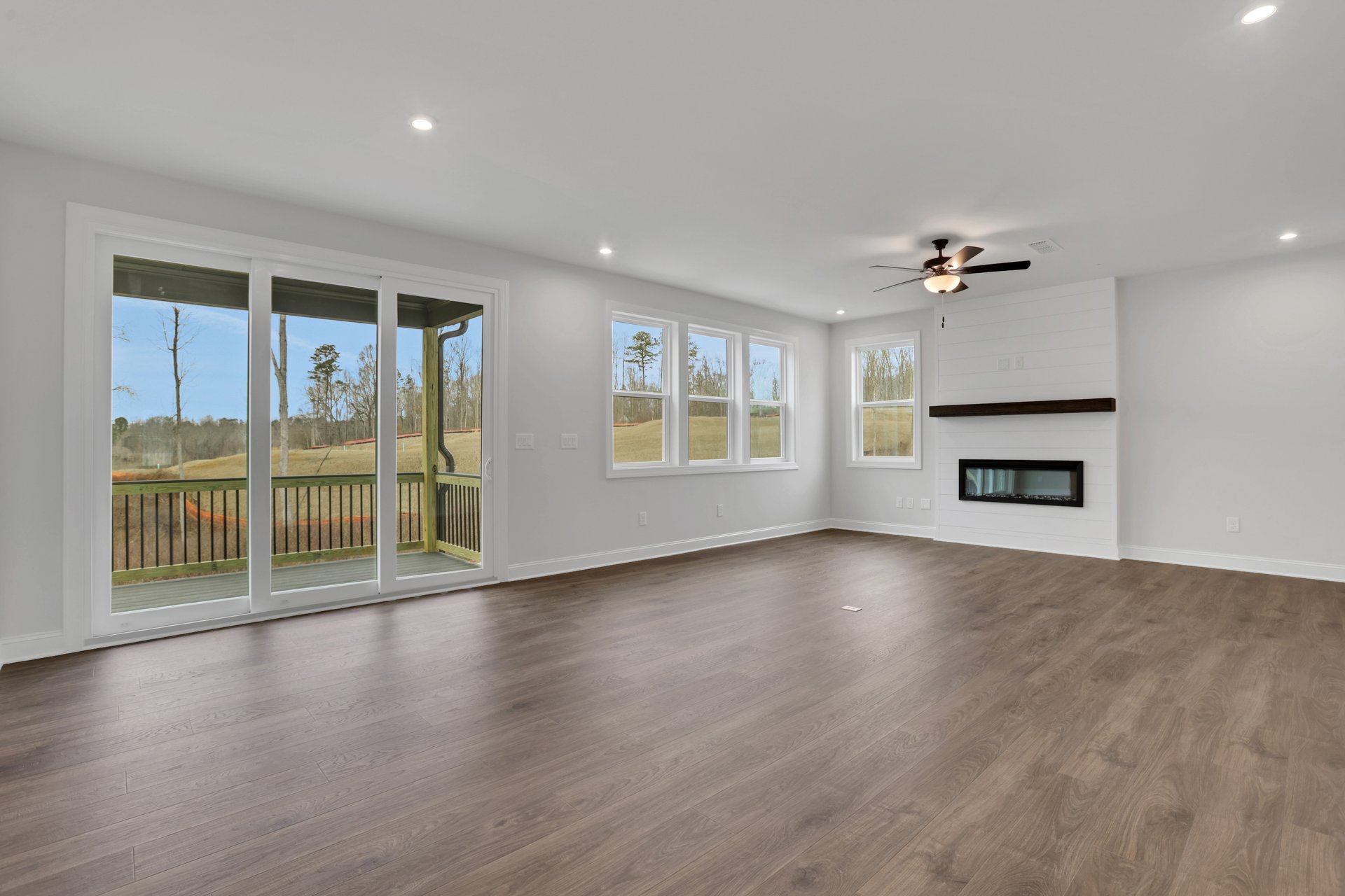 great room with electric fireplace and hard surface flooring