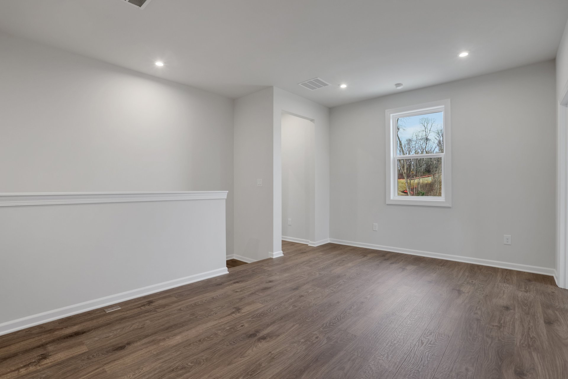 loft with hard surface flooring and windows